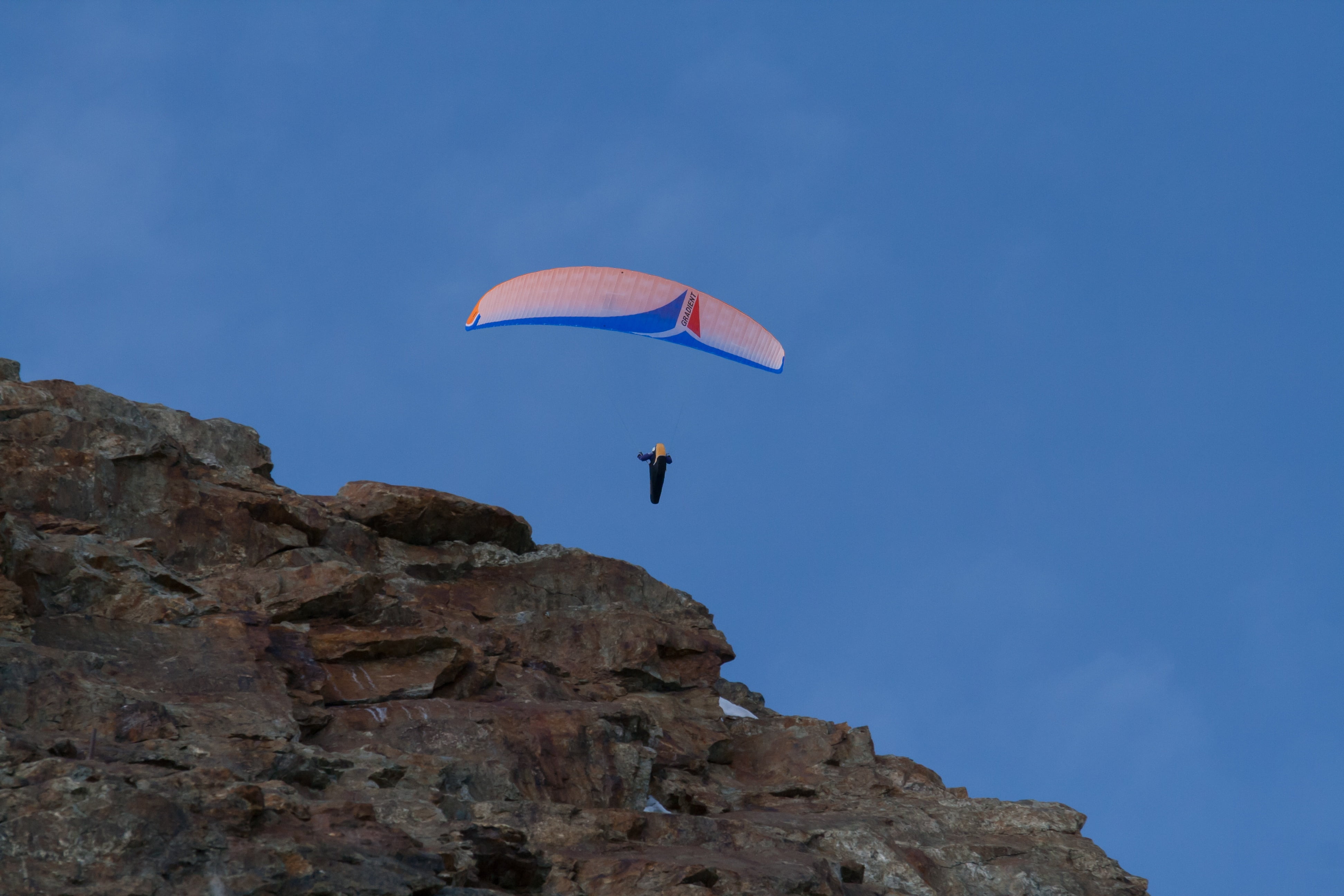 rock, sky, extreme sports, leisure activity, outdoors, mid-air, unrecognizable person, sport, blue, nature, day, risk, low angle view, flying, 4K, transportation, HD Wallpaper