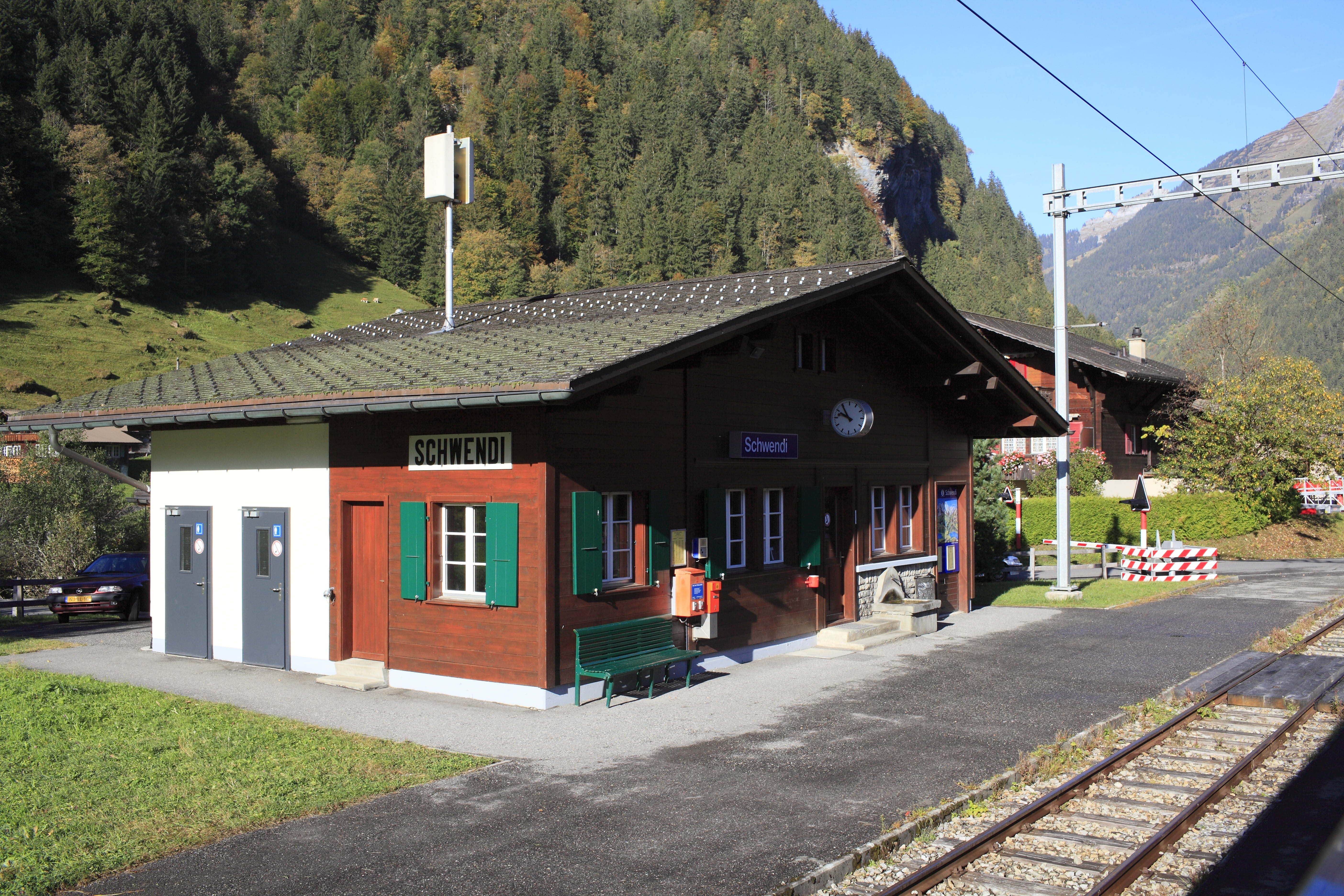 rail transportation, train station, road, house, sky, mountain, tree, plant, street, grindelwald, nature, city, 5K, travel, building, track, mode of transportation, HD Wallpaper