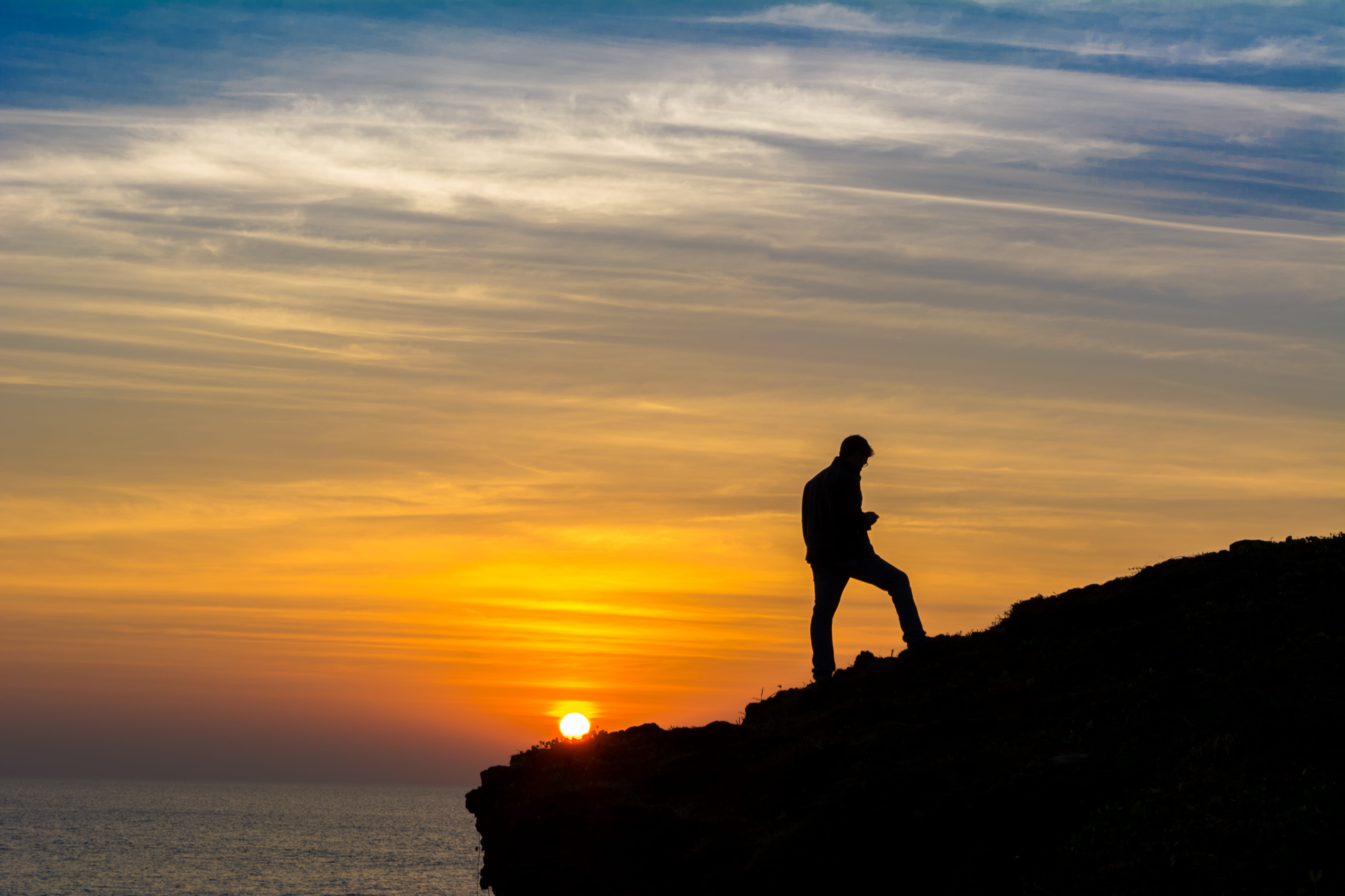outdoors, solid, hour, sunset, man, walking, lifestyles, golden, nature, rock - object, one person, sky, person, male, orange color, water, beauty in nature, HD Wallpaper
