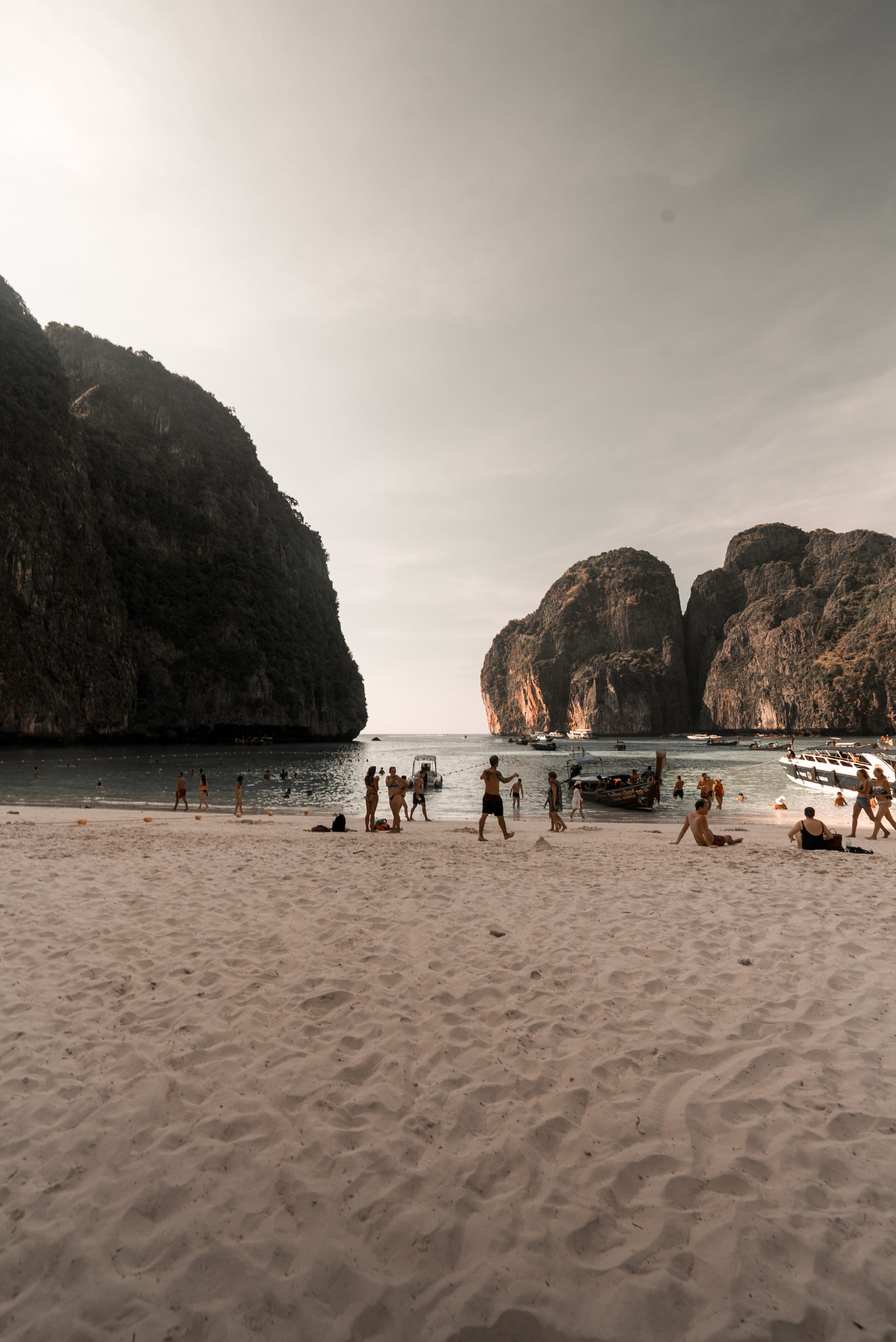 bay, cliff, people, mountain, maya bay, holiday, outdoors, beauty in nature, yacht, boats, ships, coast, beach, shore, scenics - nature, sunset, sea, waves, Phone HD Wallpaper