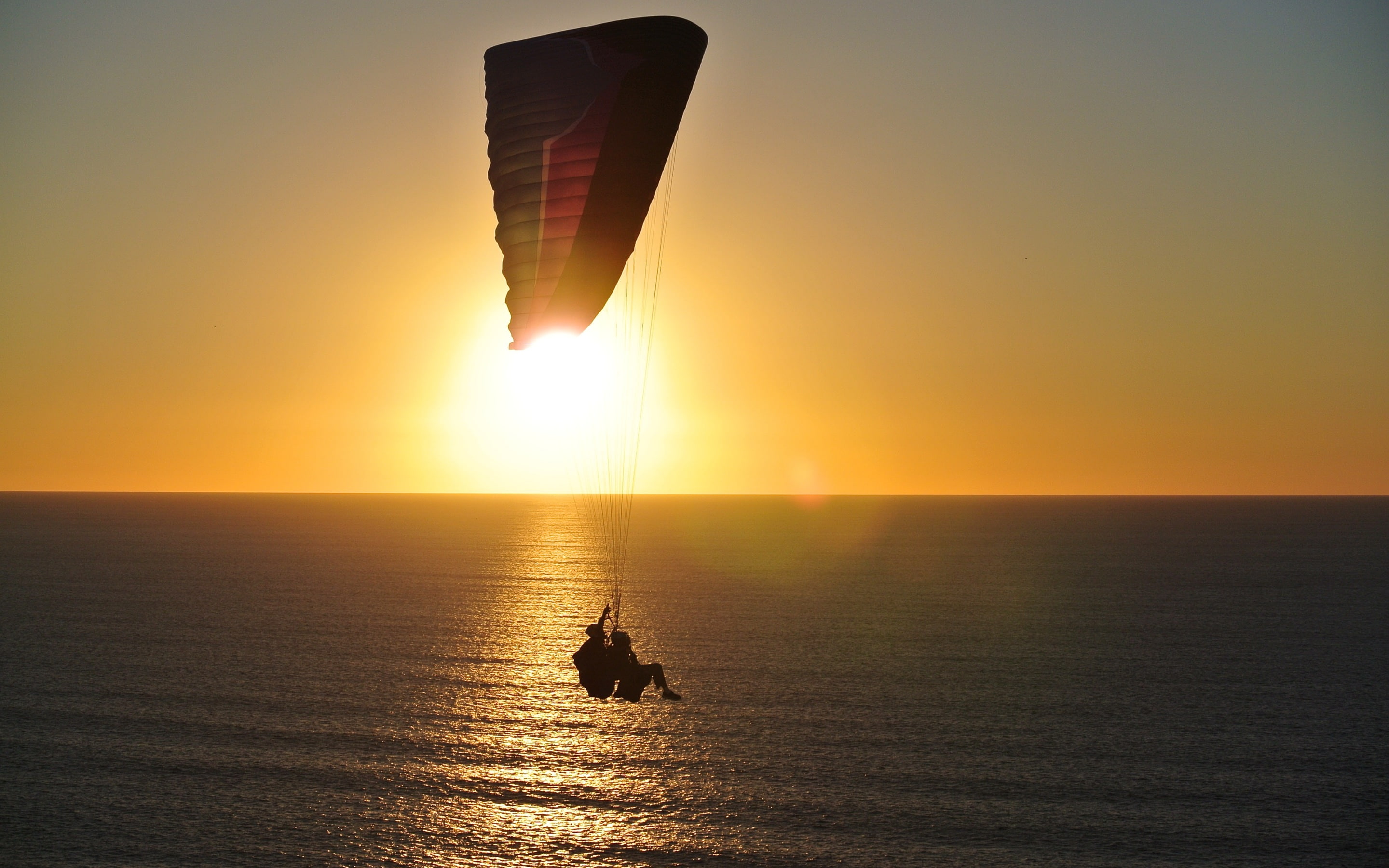 joy, sunrise, 2K, paragliding, people, adventure, sea, sunset, water, fun, silhouette, person, flying, parachute, HD Wallpaper