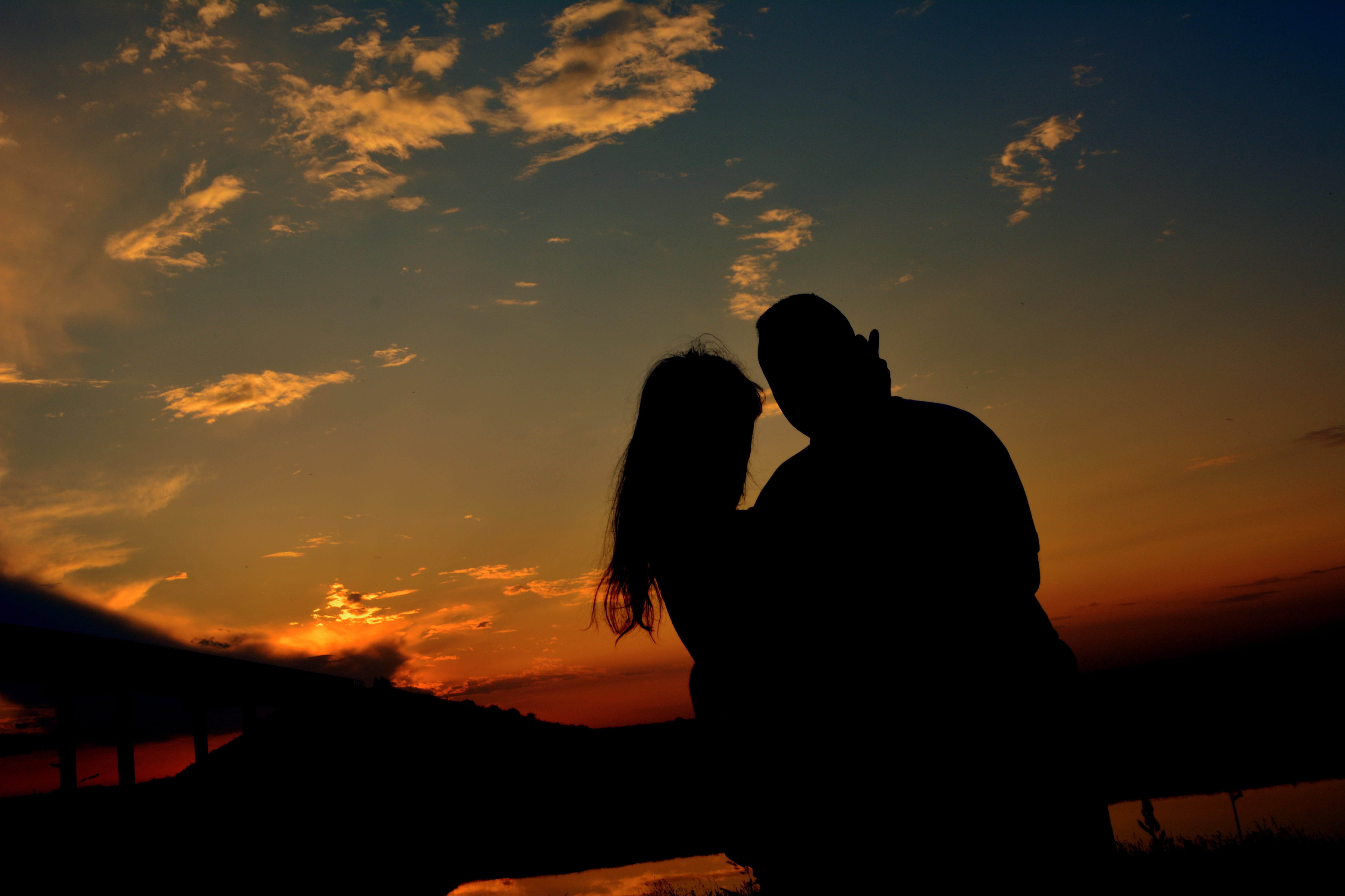 Sunset, adult, Couple, sky, two people, women, water, nature, silhouette, romance, couple - relationship, emotion, orange color, bonding, real people, togetherness, HD Wallpaper