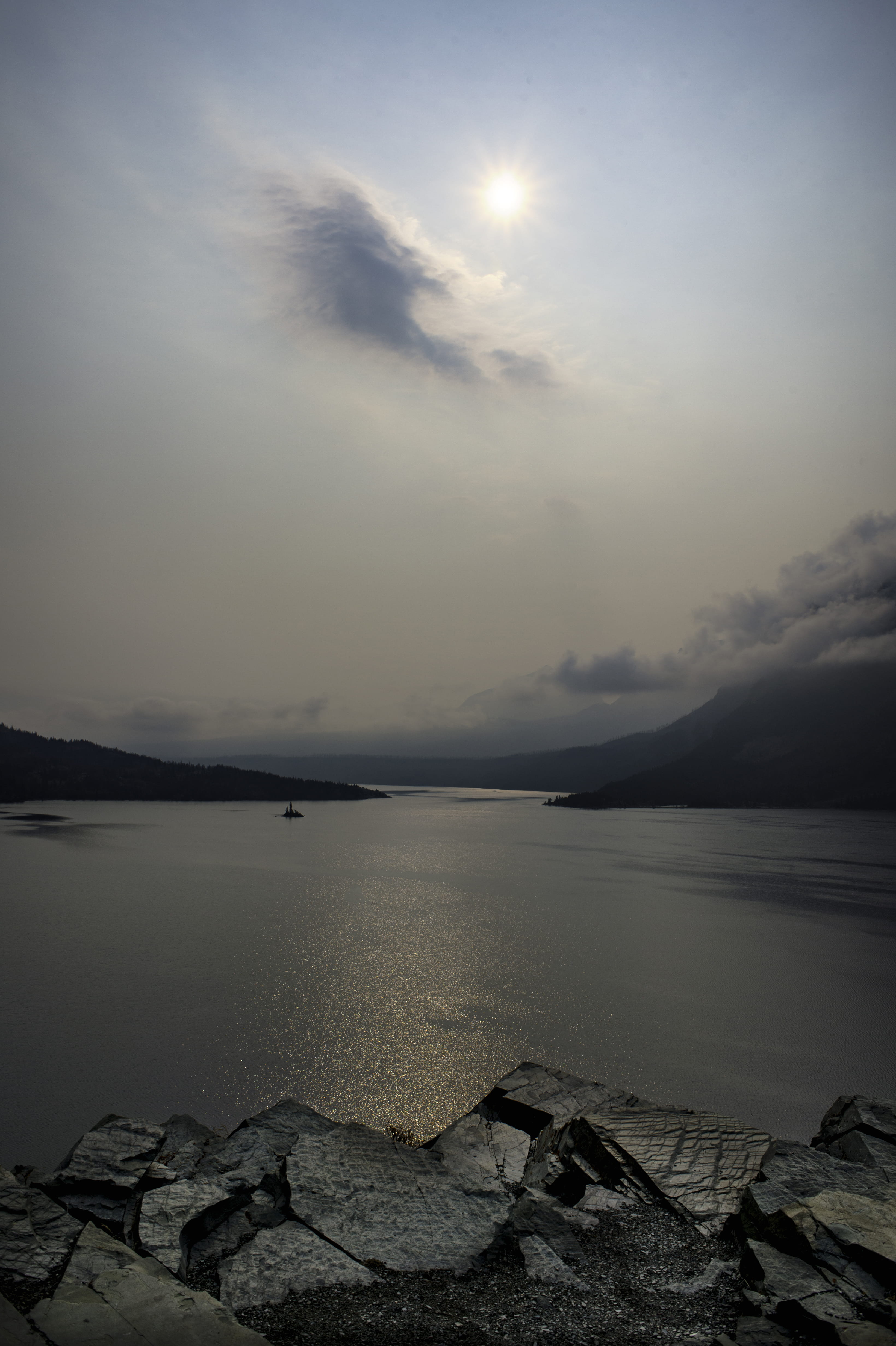 tranquility, tranquil scene, glacier national park, no people, mountains, clearing storm, idyllic, smoke, island, sun, nature, rock - object, solid, sea, Phone HD Wallpaper