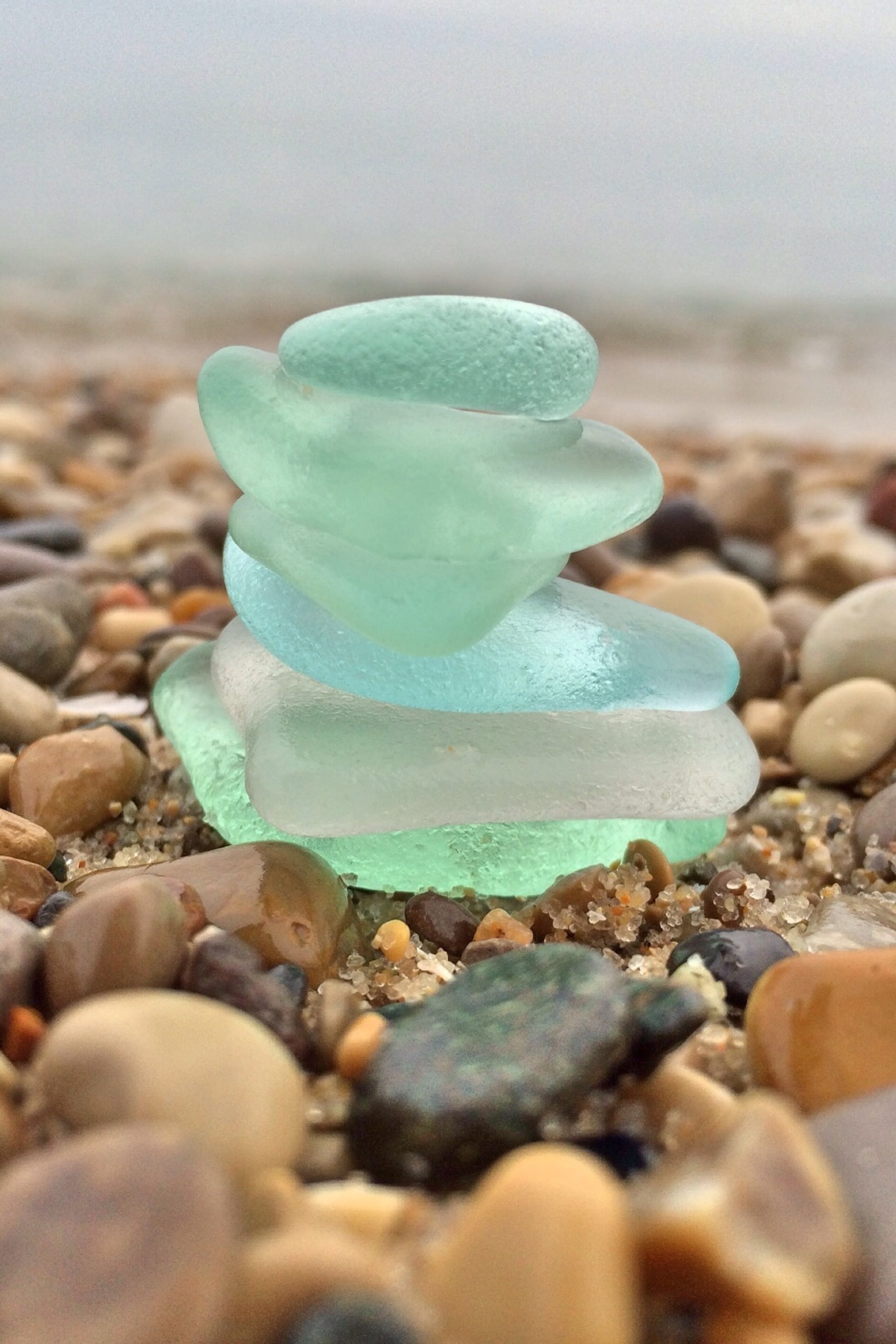 stone - Object, 2K, land, stack, beach, shore, nature, rock - Object, green, stones, sweet, beach glass, solid, close-up, selective focus, pebble, surface level, Phone HD Wallpaper