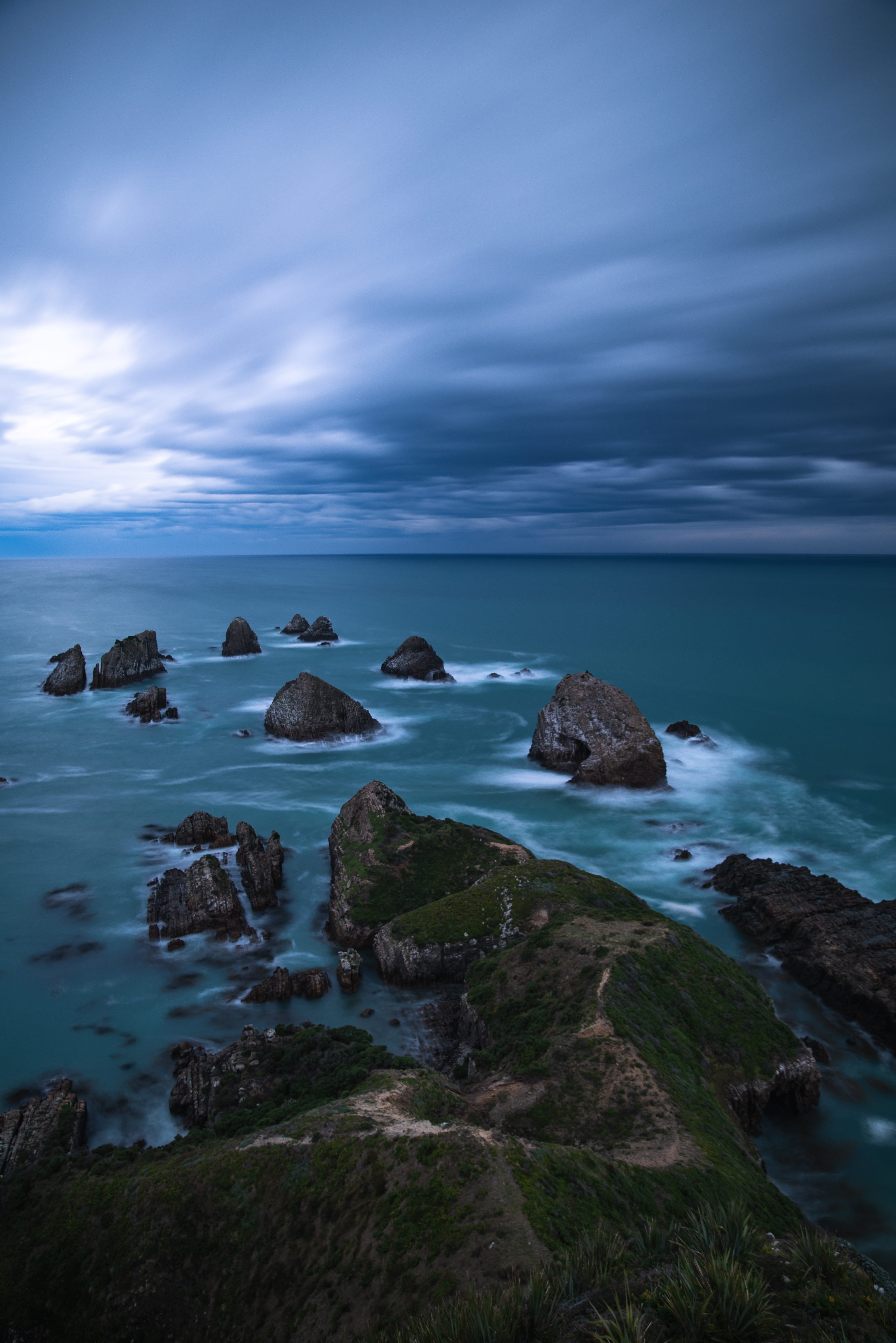 solid, landscape, ocean, horizon over water, sky, water, sea, gray, 5K, new zealand, clouds, explore, outdoors, rock, photography, cloud, travel, Phone HD Wallpaper