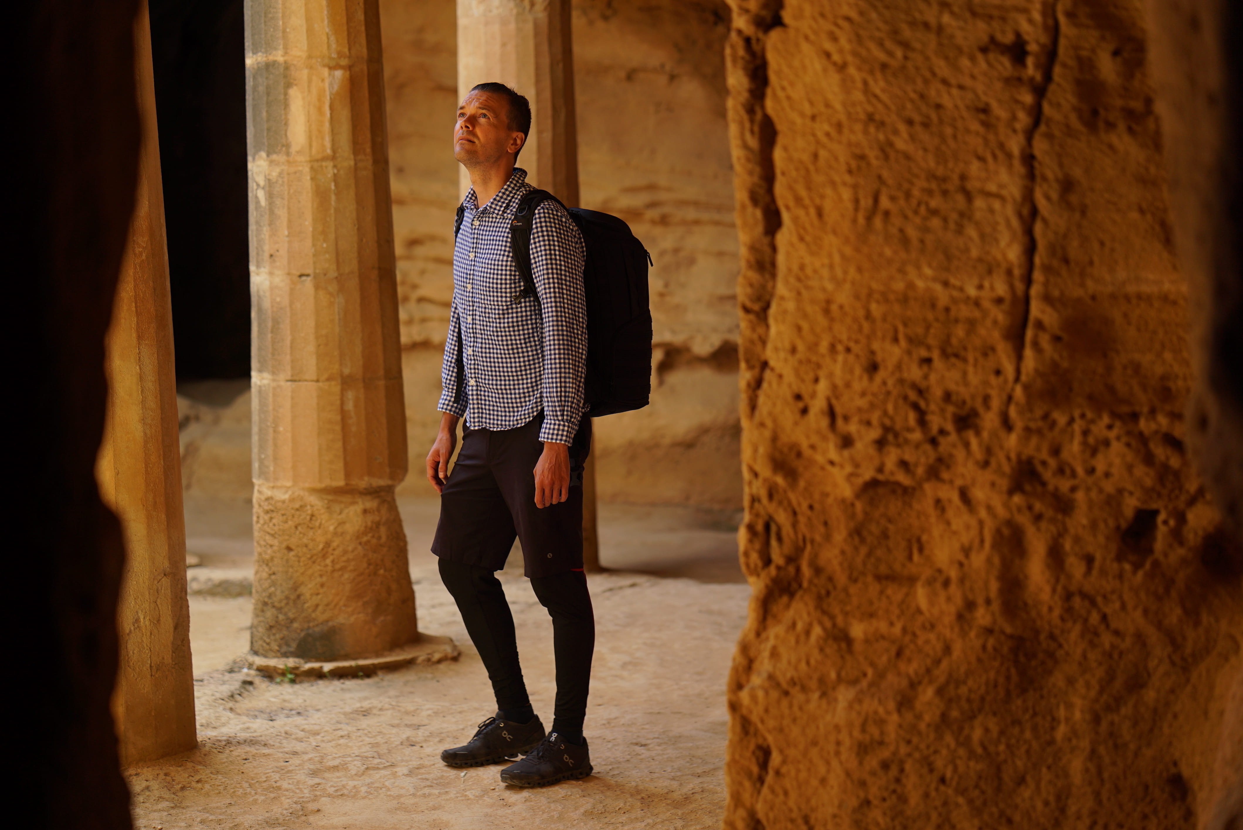 young adult, shirt, apparel, ruins, ancient, casual clothing, front view, shoe, human, standing, footwear, look up, architecture, young men, paphos, traveler, HD Wallpaper