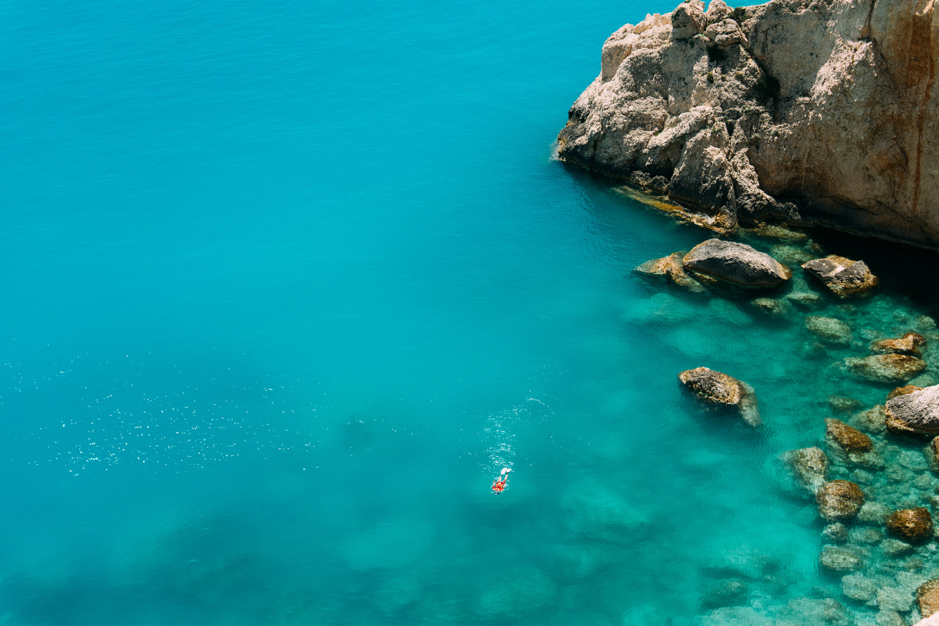 cliff, water, turquoise colored, blue, solid, formation, idyllic, high angle view, near, outdoors, stones, nature, ocean, s, greece, swimming, tropical, HD Wallpaper
