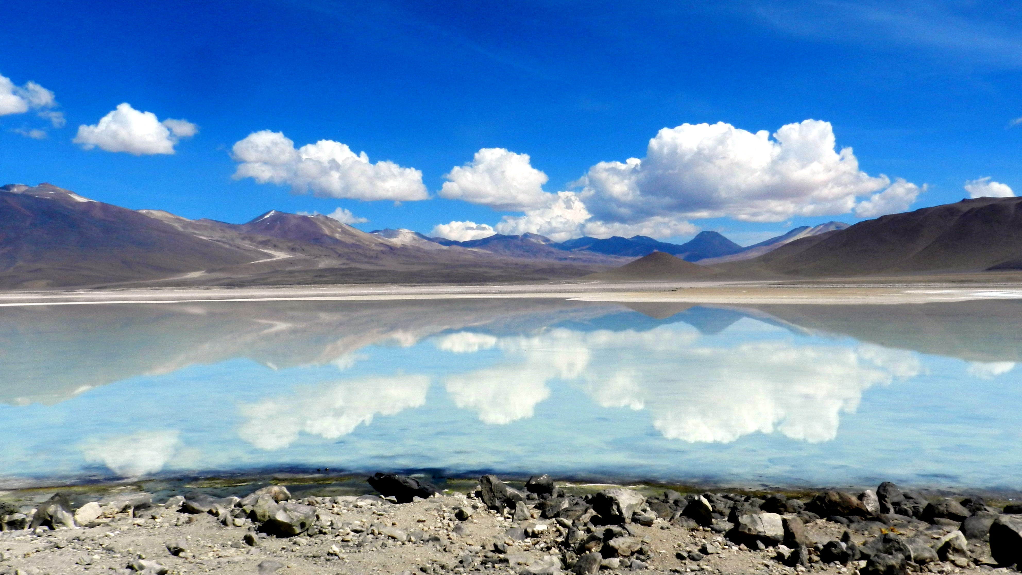 landscape, lago, nature, tranquil scene, cloud, blue, outdoors, beauty in nature, sky, day, travel destinations, environment, lake, rocks, large, stones, HD Wallpaper