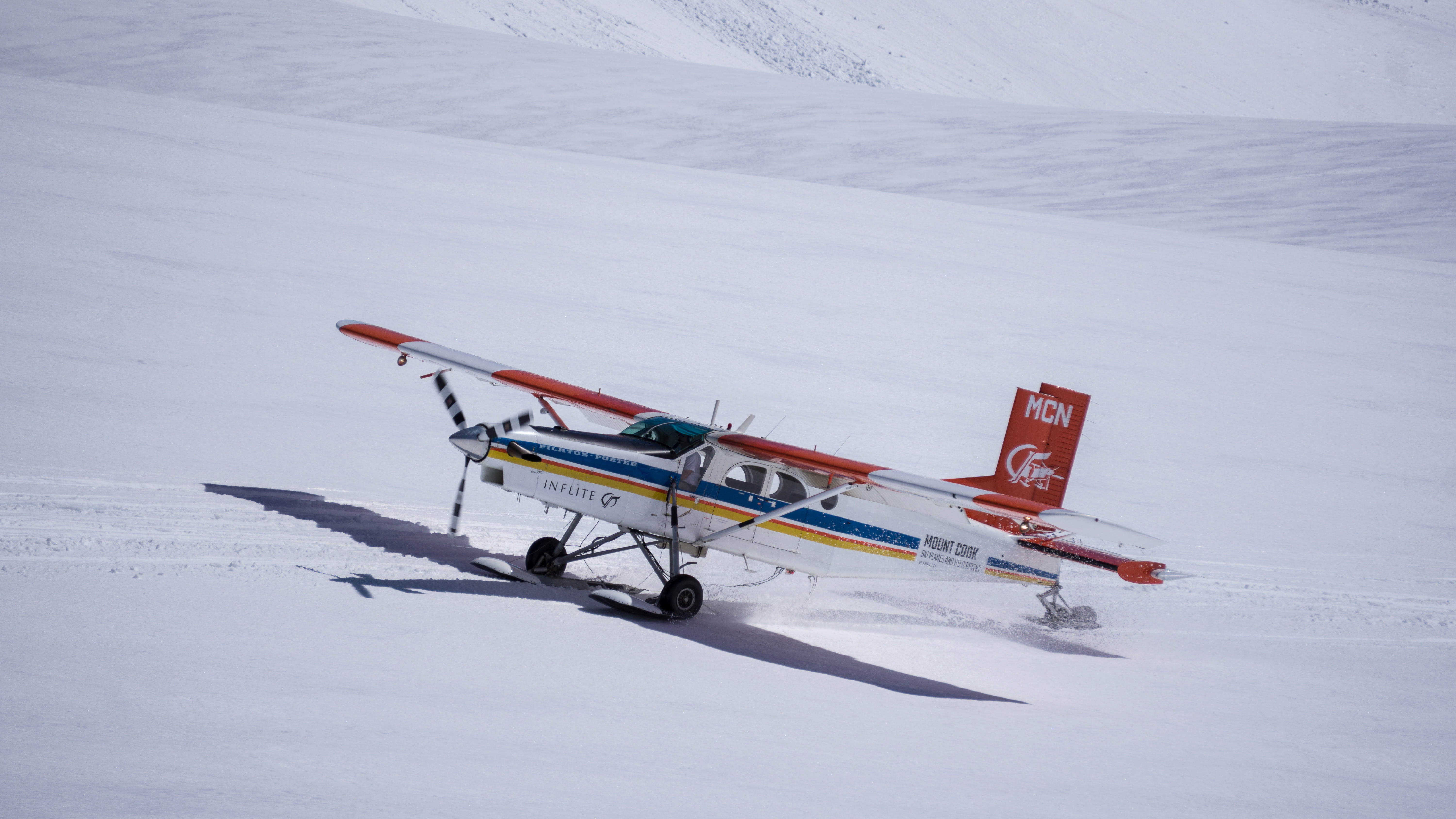 daytime, air vehicle, red, mountain, winter sport, white color, plane, day, photo, environment, 5K, flying, mode of transportation, outdoors, cold temperature, HD Wallpaper