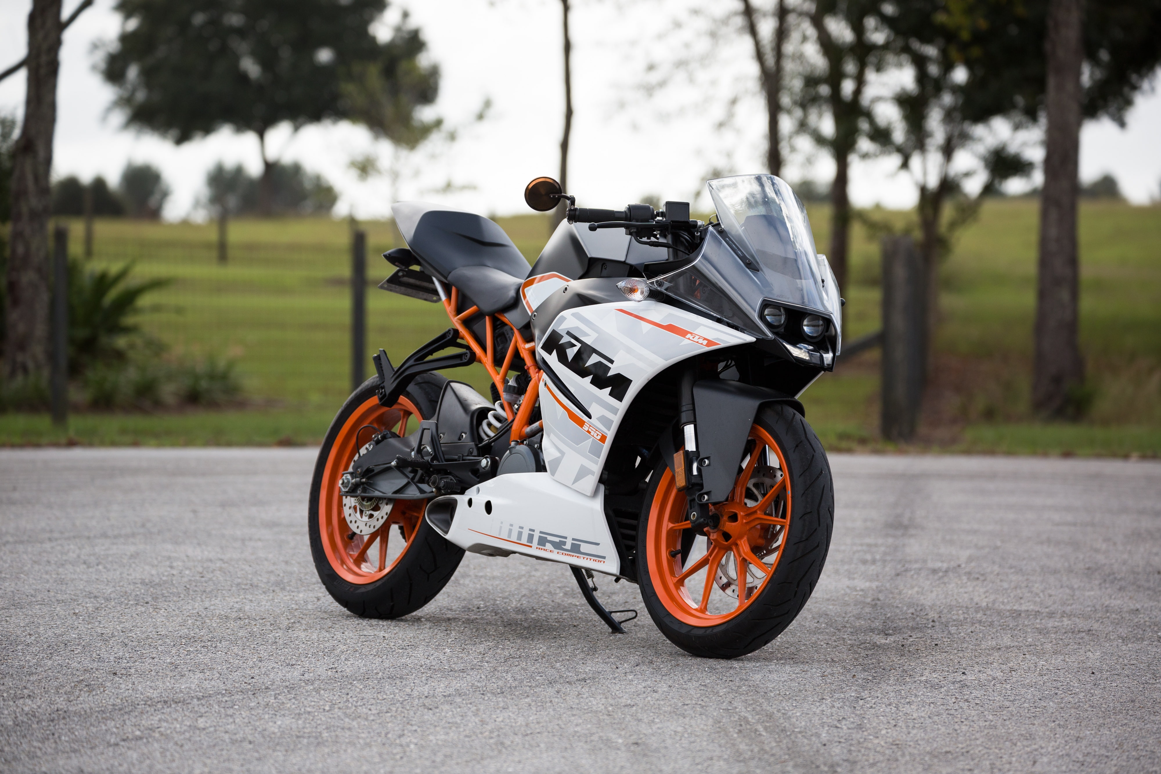 tree, sports helmet, riding, mode of transportation, white, city, Vehicle, motorcycle, sport, driving, stationary, side view, focus on foreground, 4K, HD Wallpaper