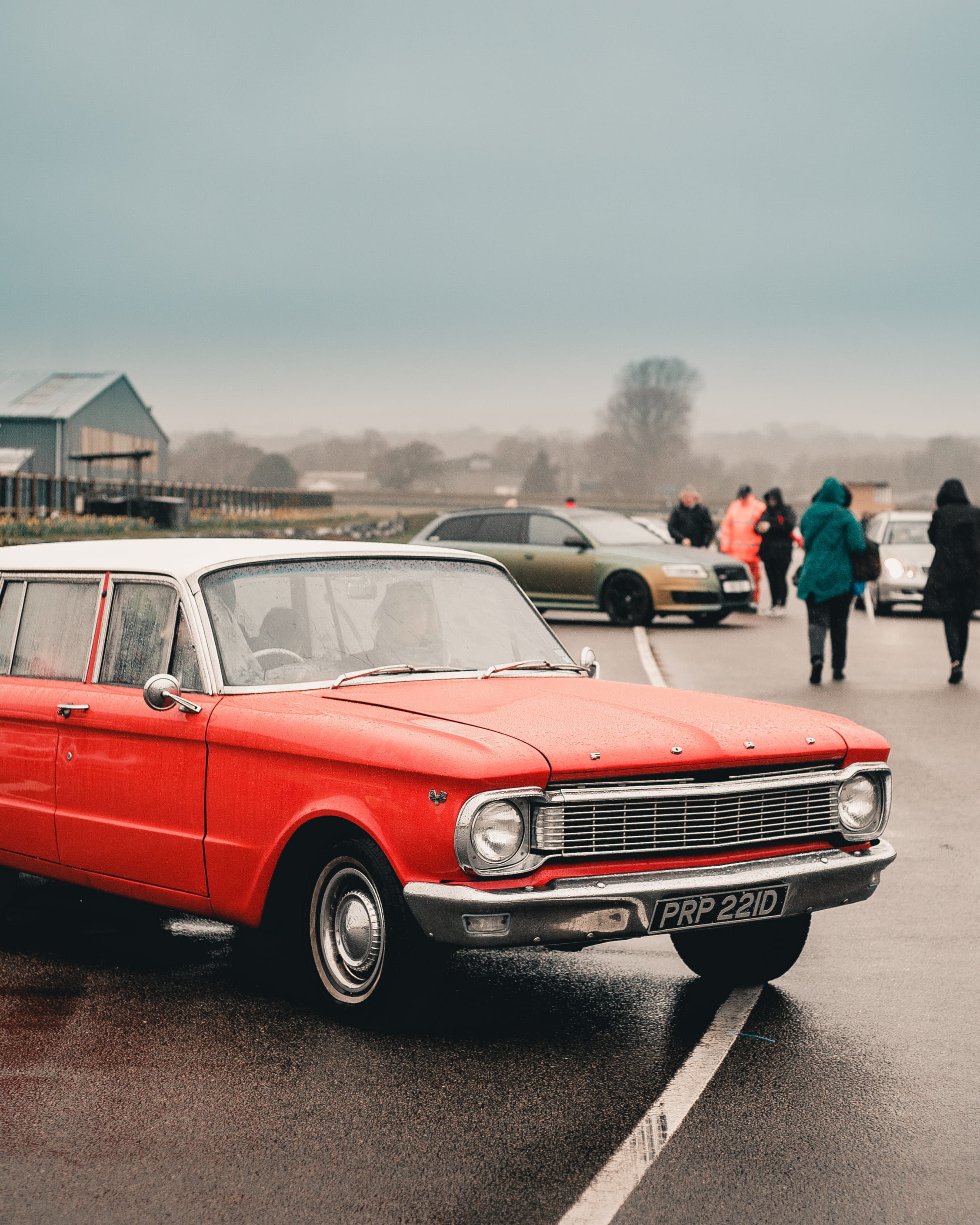 road, tire, asphalt, incidental people, real people, retro styled, person, spoke, coupe, alloy wheel, building exterior, outdoors, 2K, red, human, sky, Phone HD Wallpaper