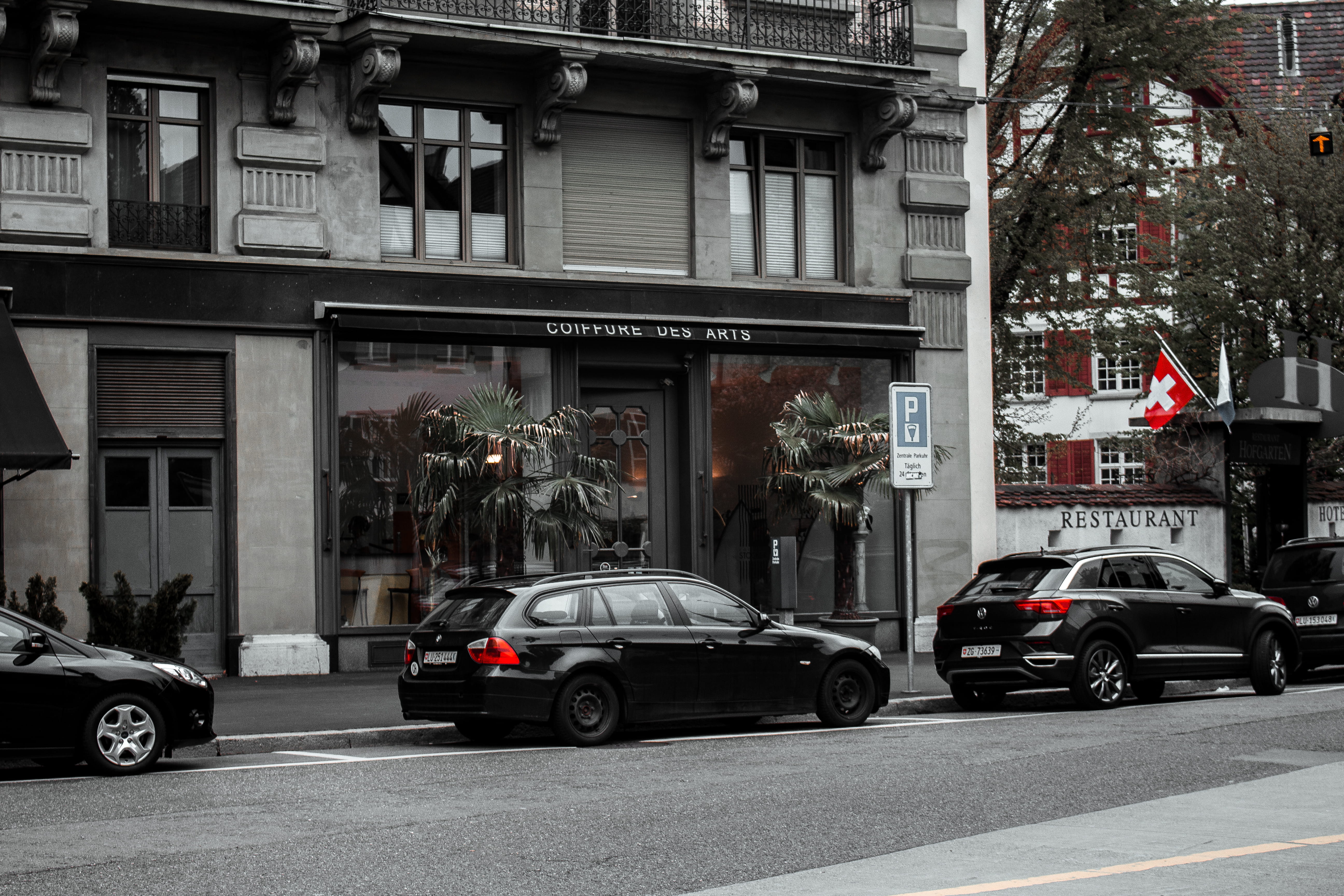 sports car, day, intersection, text, automobile, sign, tree, wheel, tire, 5K, alloy wheel, coupe, building exterior, transportation, home decor, architecture, HD Wallpaper