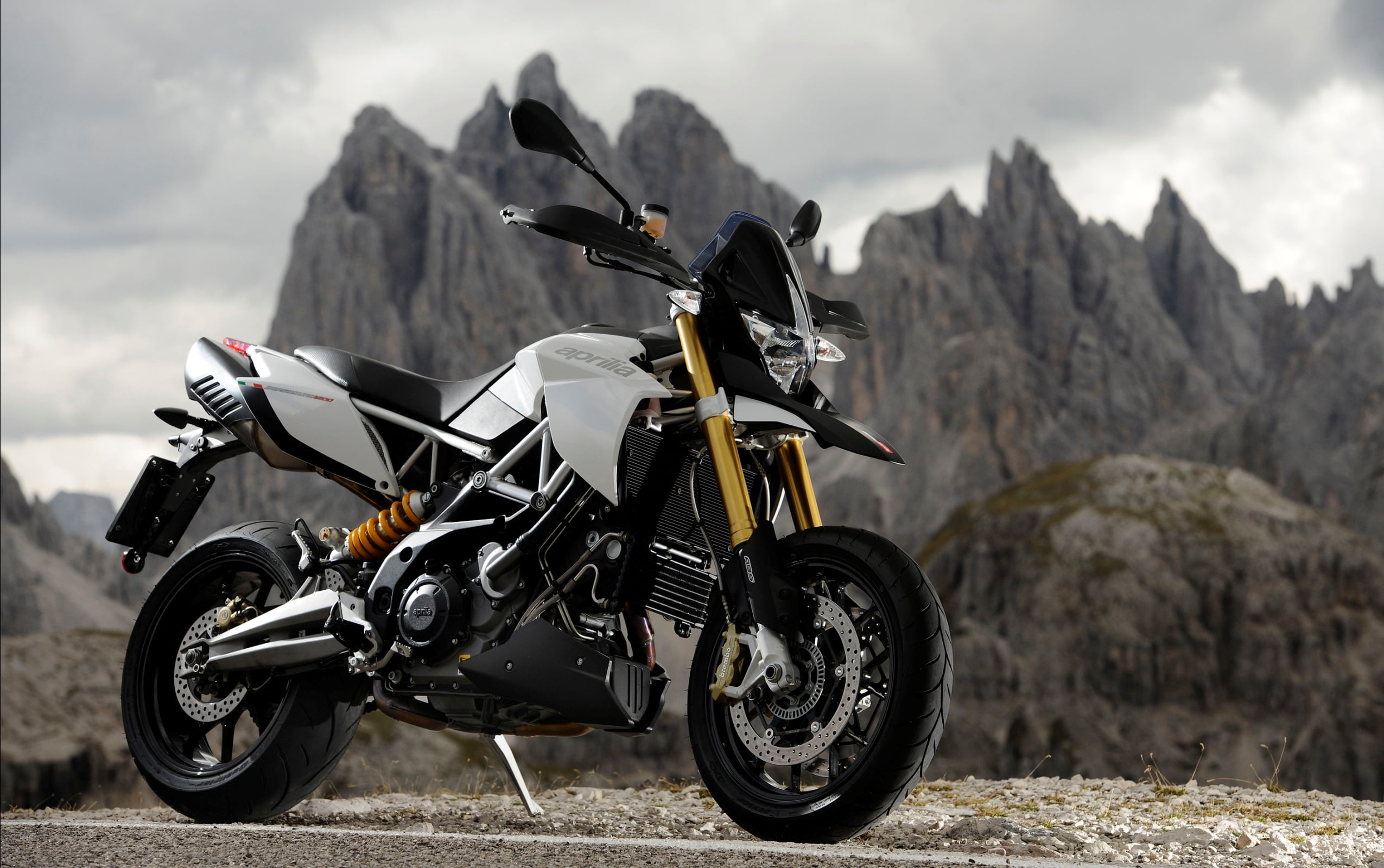 cloud - sky, bike, helmet, sport, stationary, dorsoduro, black, Aprilia, non-urban scene, sports race, land vehicle, gray, motorcycle, extreme sports, transportation, HD Wallpaper