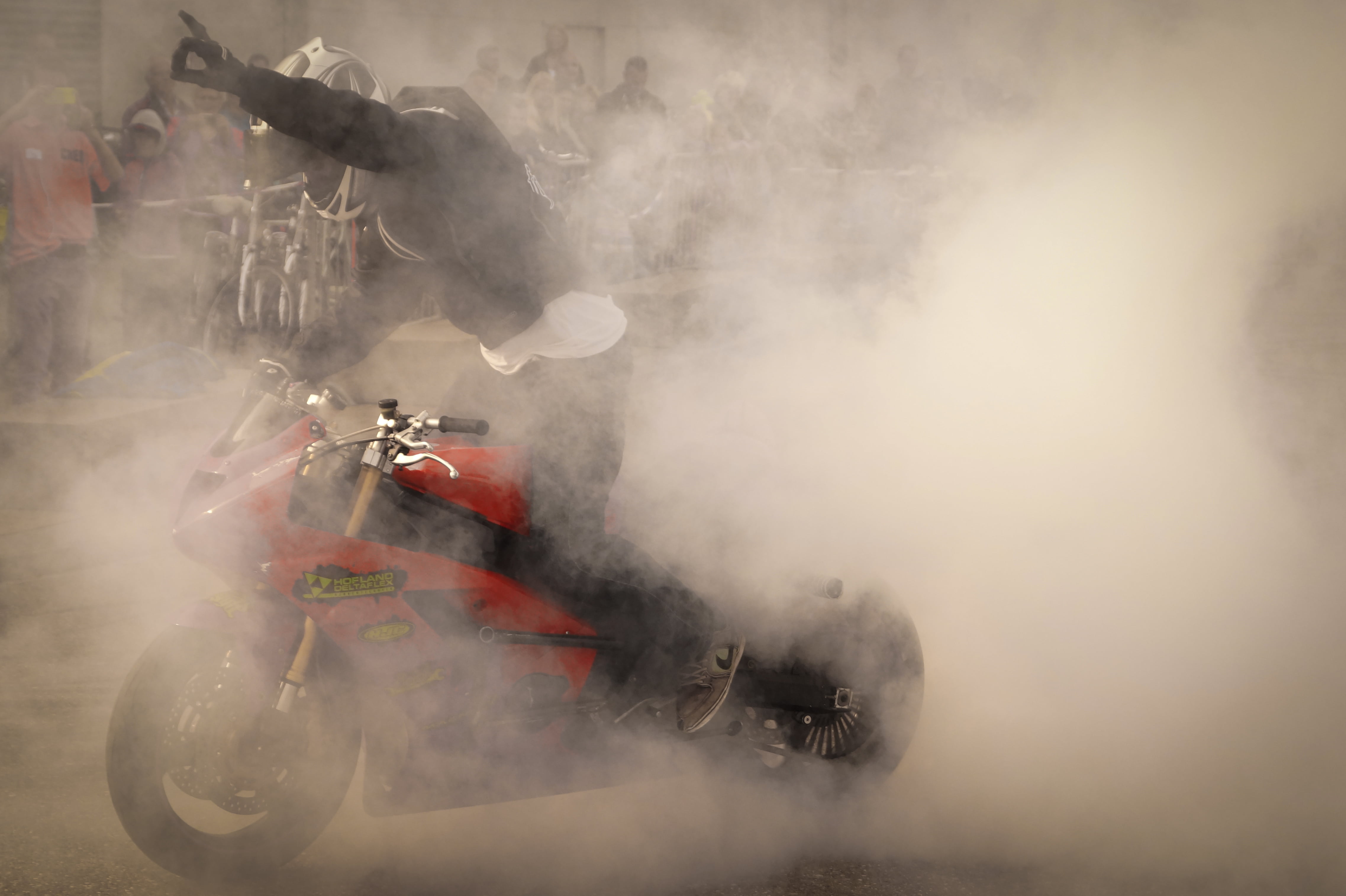 driving, set, transportation, burnout, motion, motorcycle, 4K, mode of transportation, crash helmet, people, man, stunts, smoke, competition, warning sign, HD Wallpaper