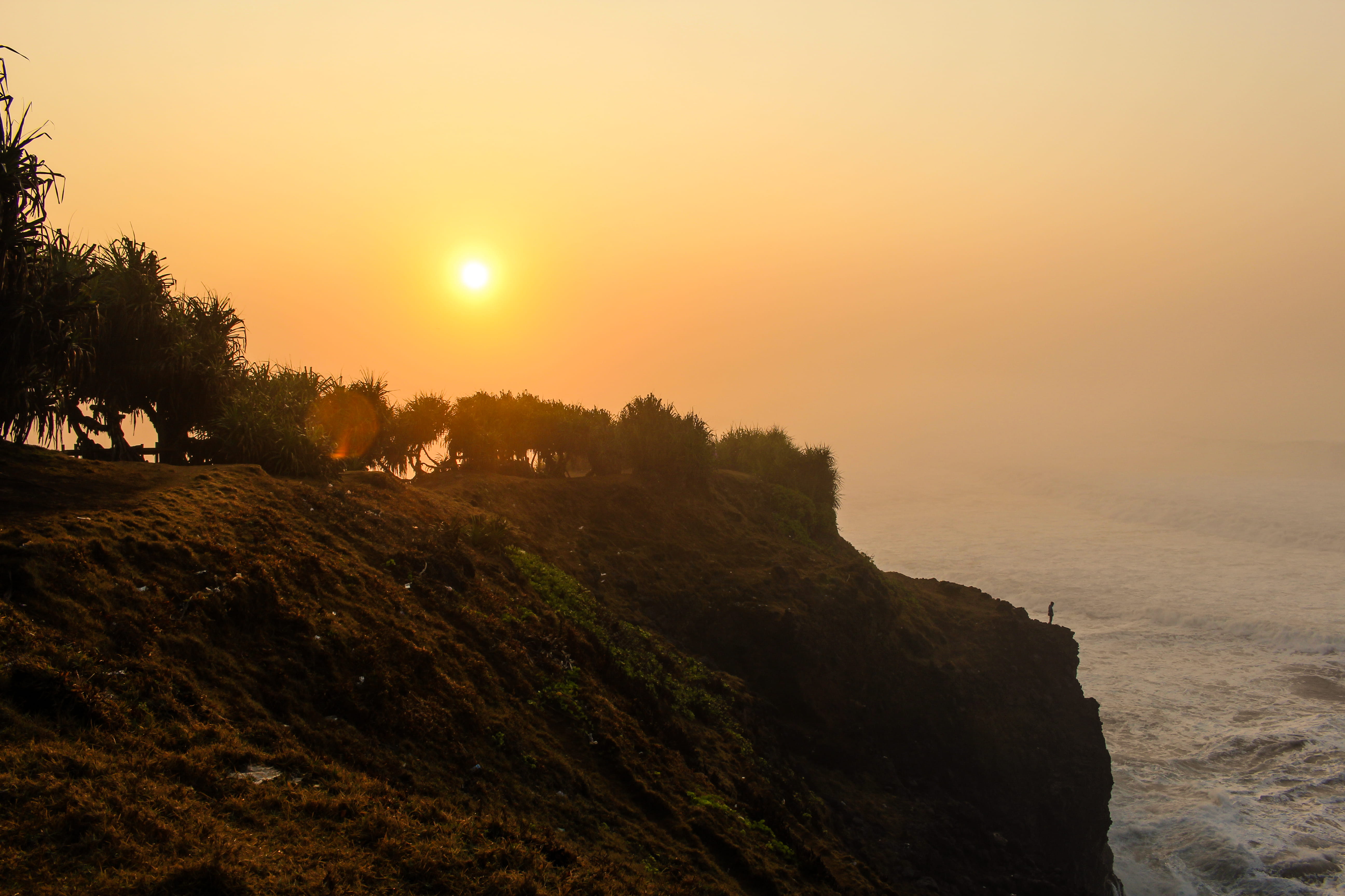 cliff, near, tranquility, Guha, tree, sunset, water, Puncak, sea, se, dusk, scenics - nature, mountain, beach, golden, tranquil scene, coastline, orange color, HD Wallpaper