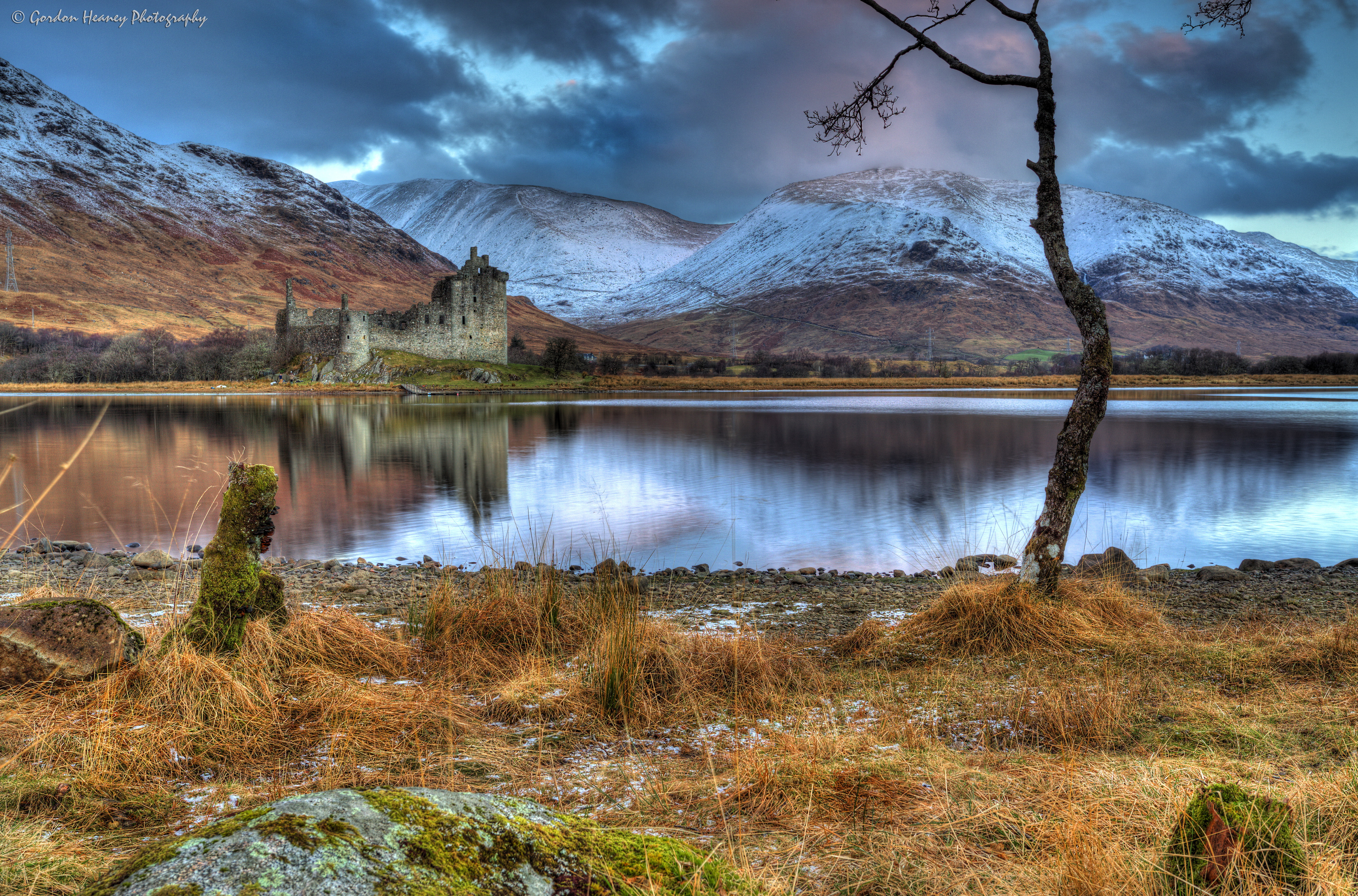 stones, plant, water, environment, snowcapped mountain, mountains, Scotland, castle, snow, landscape, shore, cloud - sky, covered, Kilchurn Castle, tranquil scene, HD Wallpaper