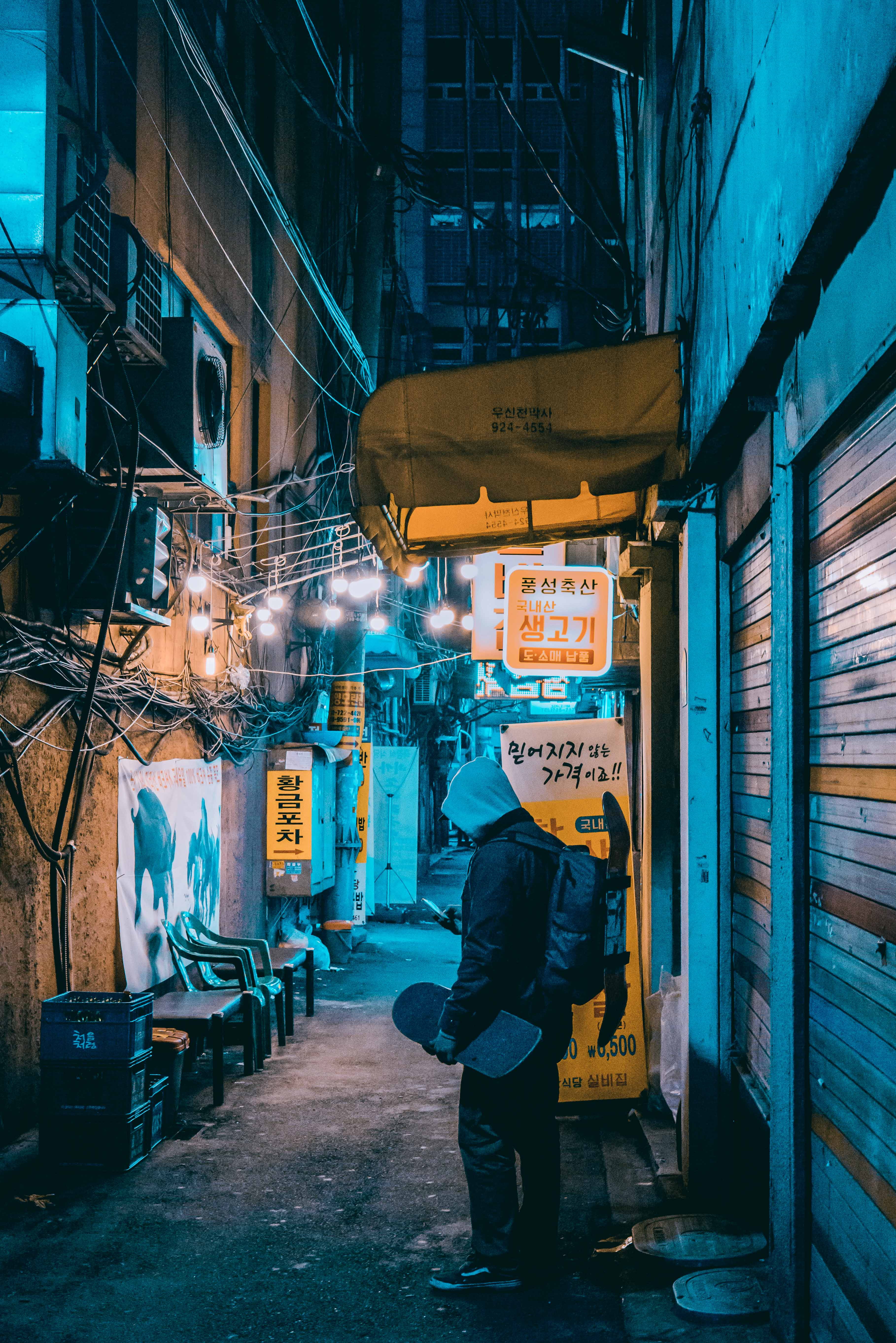 real people, south korea, full length, walking, rear view, night, market, standing, graffiti, city, furniture, outdoors, urban, hoodie, one person, building, Phone HD Wallpaper