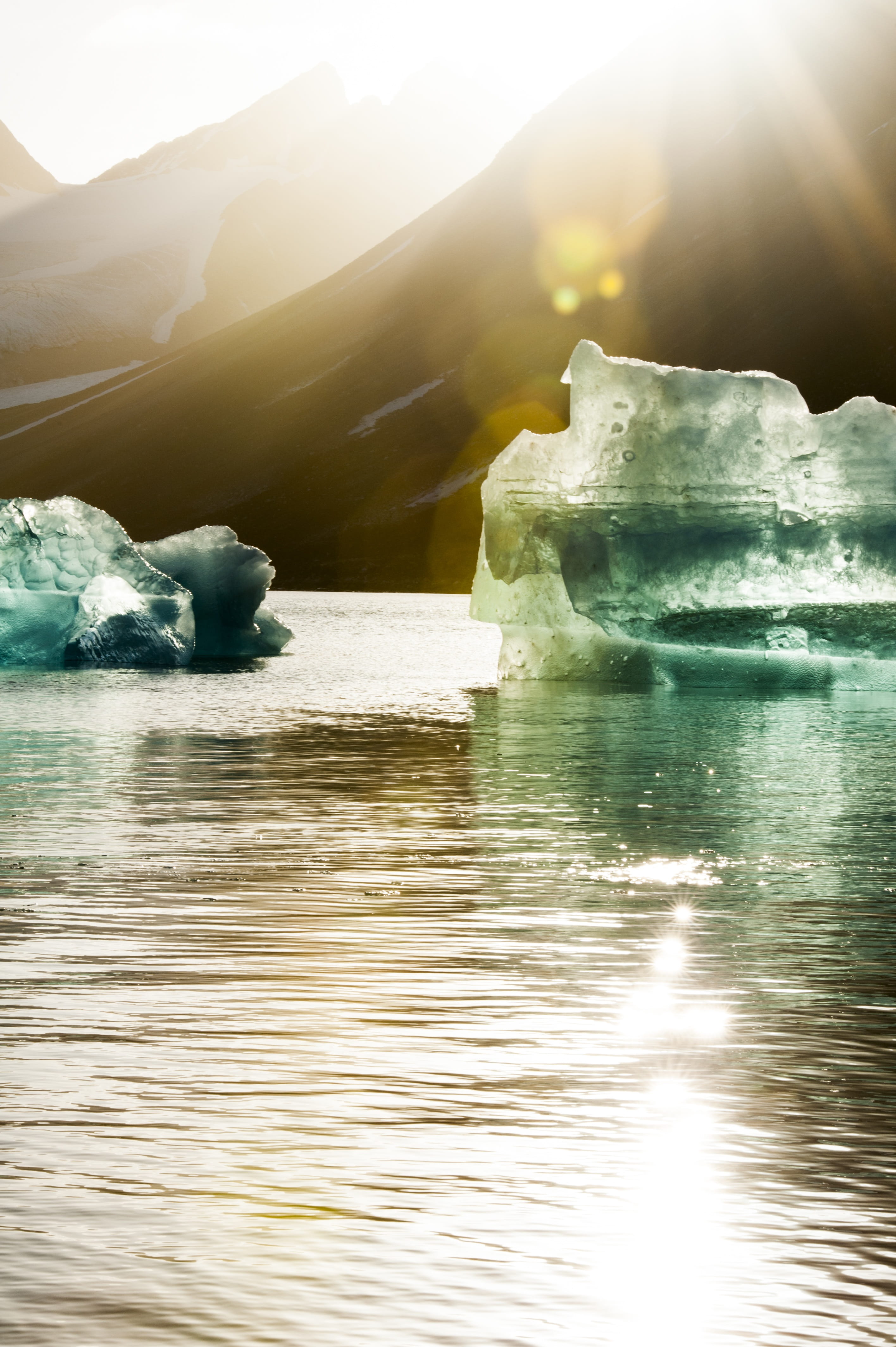 outdoors, no people, solid, blue, icebergs, sky, 4K, spitsbergen, nature, sunlight, coast, sun, sunbeam, sea, water, vacations, tranquility, mirroring, Phone HD Wallpaper