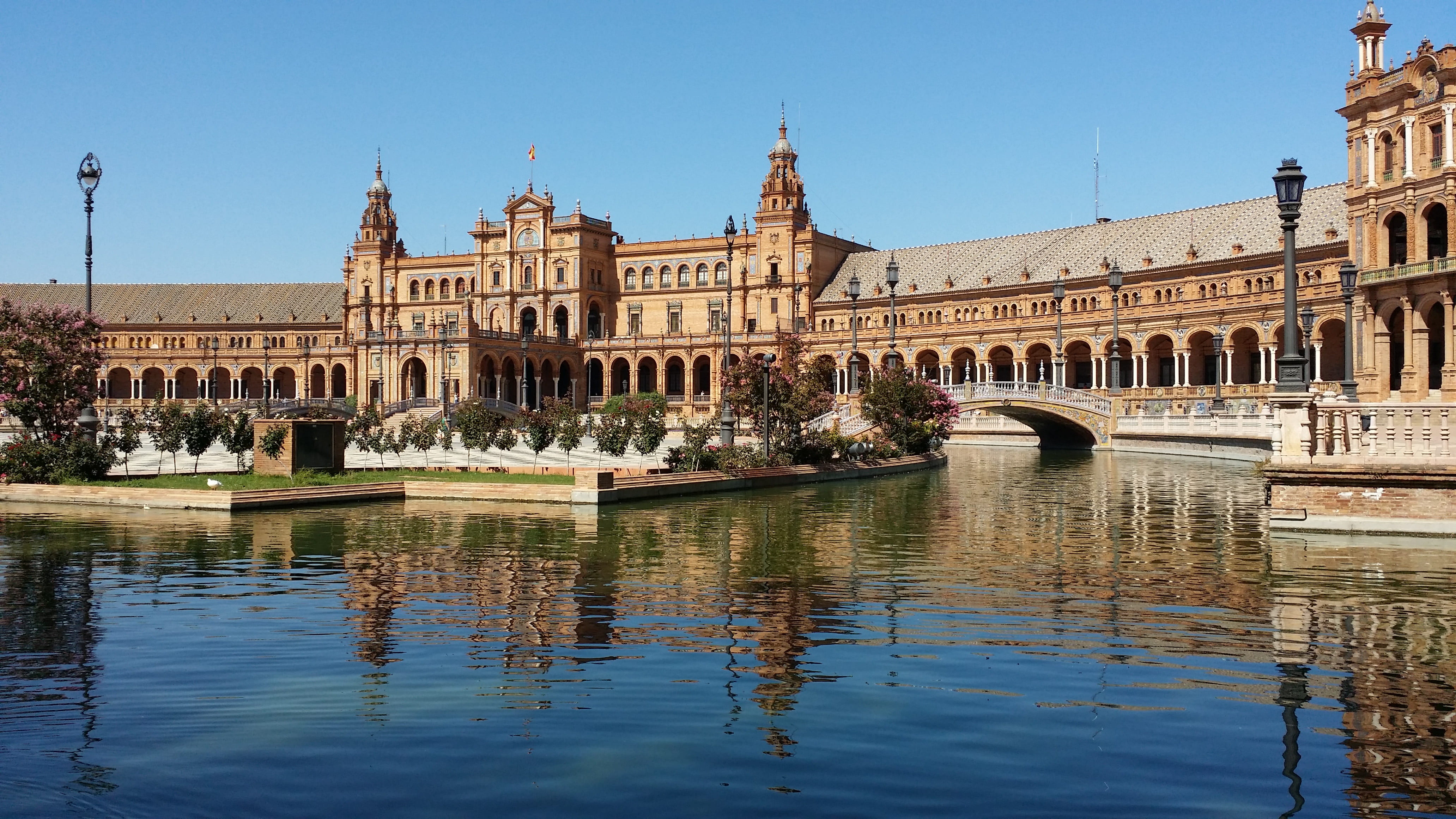 sevilla, the past, building, incidental people, reflection, city, plaza despaña, spain, travel destinations, travel, day, government, clear sky, water, HD Wallpaper