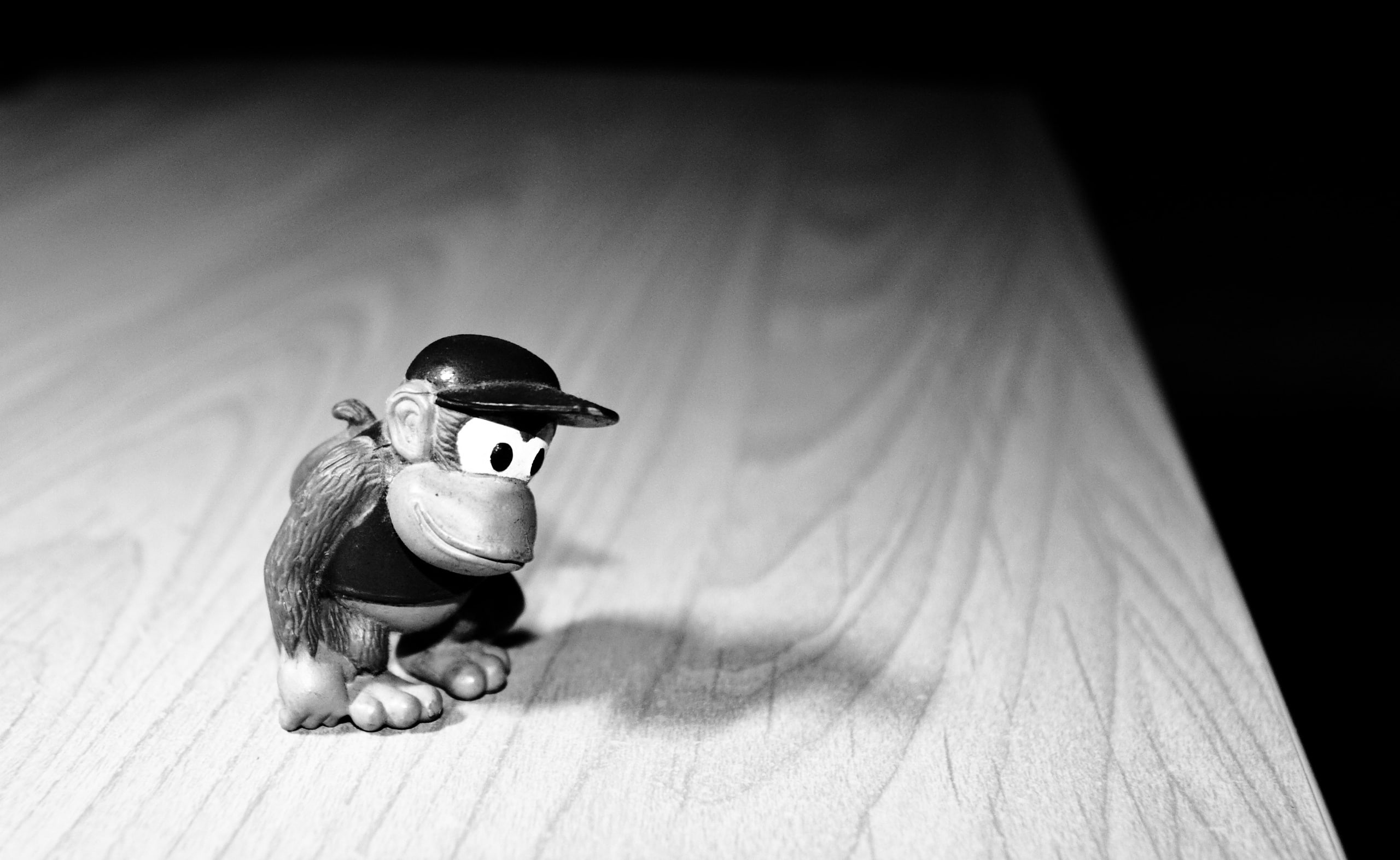 toy, black background, Aero, small, kong, offspring, childhood, figurine, child, figure, 2K, mini, shadow, indoors, black and white, wood, wood - material, HD Wallpaper