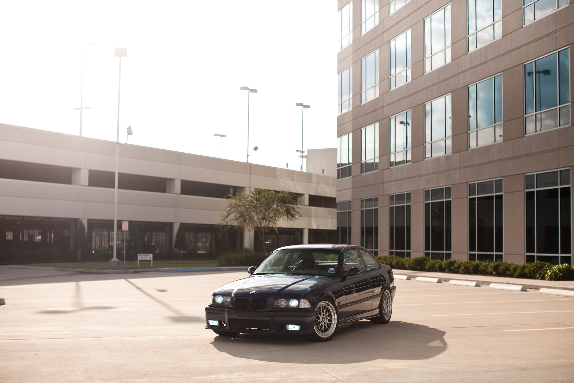 office building exterior, car, built structure, glass - material, clear sky, no people, land vehicle, building exterior, E36, outdoors, black, architecture, HD Wallpaper