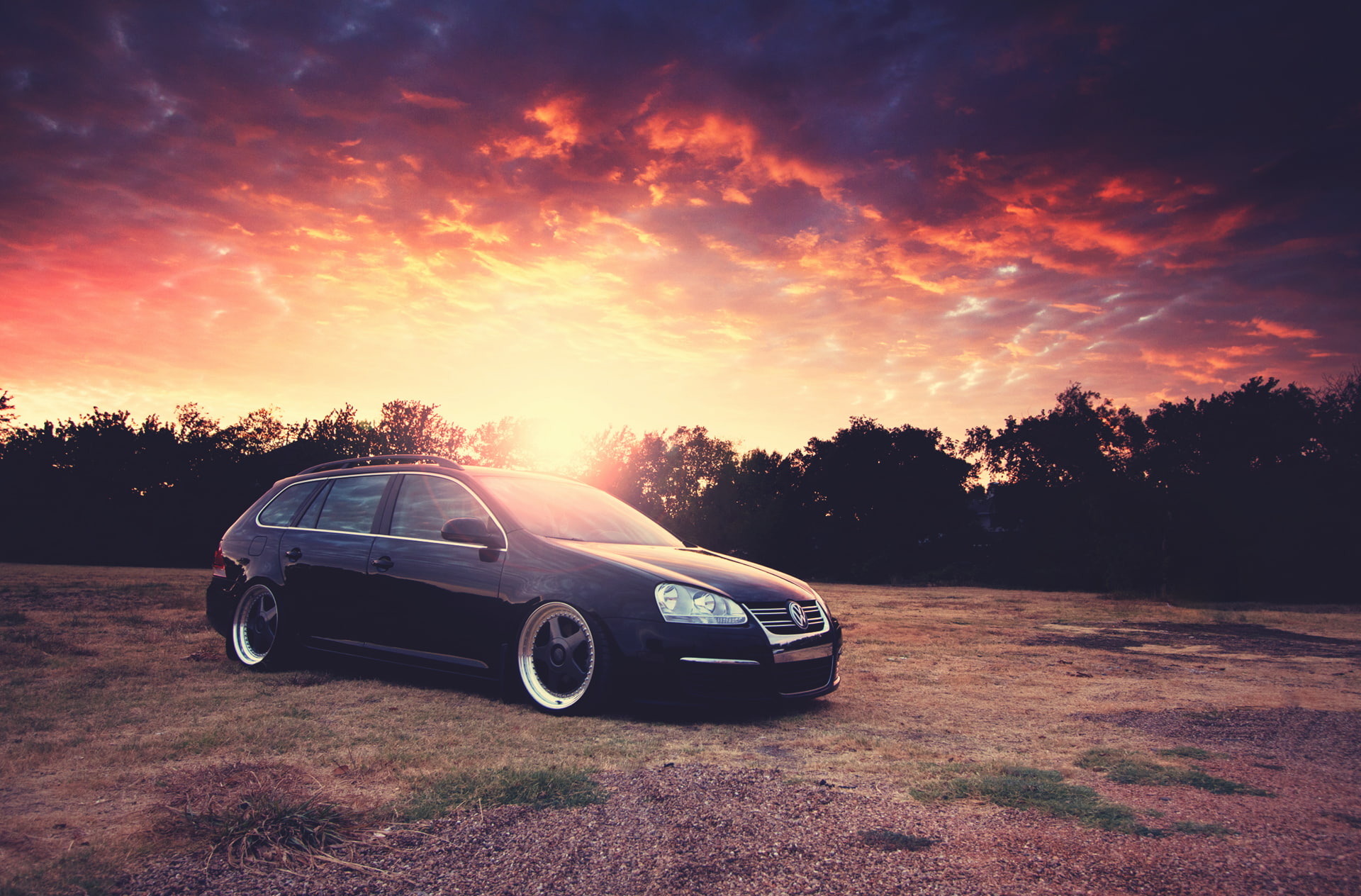 sunlight, land vehicle, Blik, no people, luxury, hatchback, Volkswagen, Golf, orange color, sky, the sun, sports car, car, plant, black, land, cloud - sky, HD Wallpaper