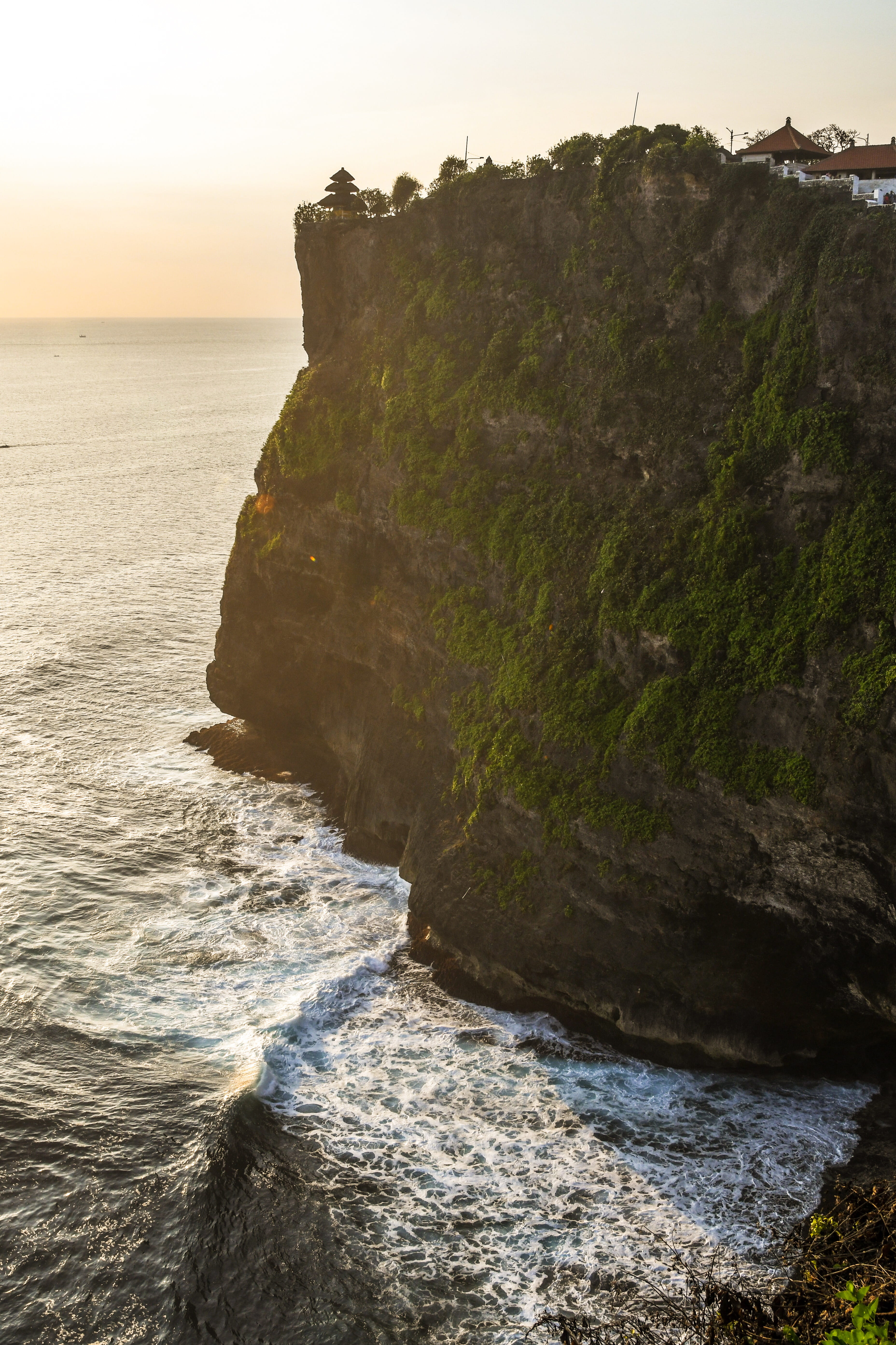 nature, sea, rock, uluwatu temple, sky, scenics - nature, sunset, 5K, bali, rock - object, tranquil scene, tranquility, solid, cliffs, outdoors, rock formation, Phone HD Wallpaper