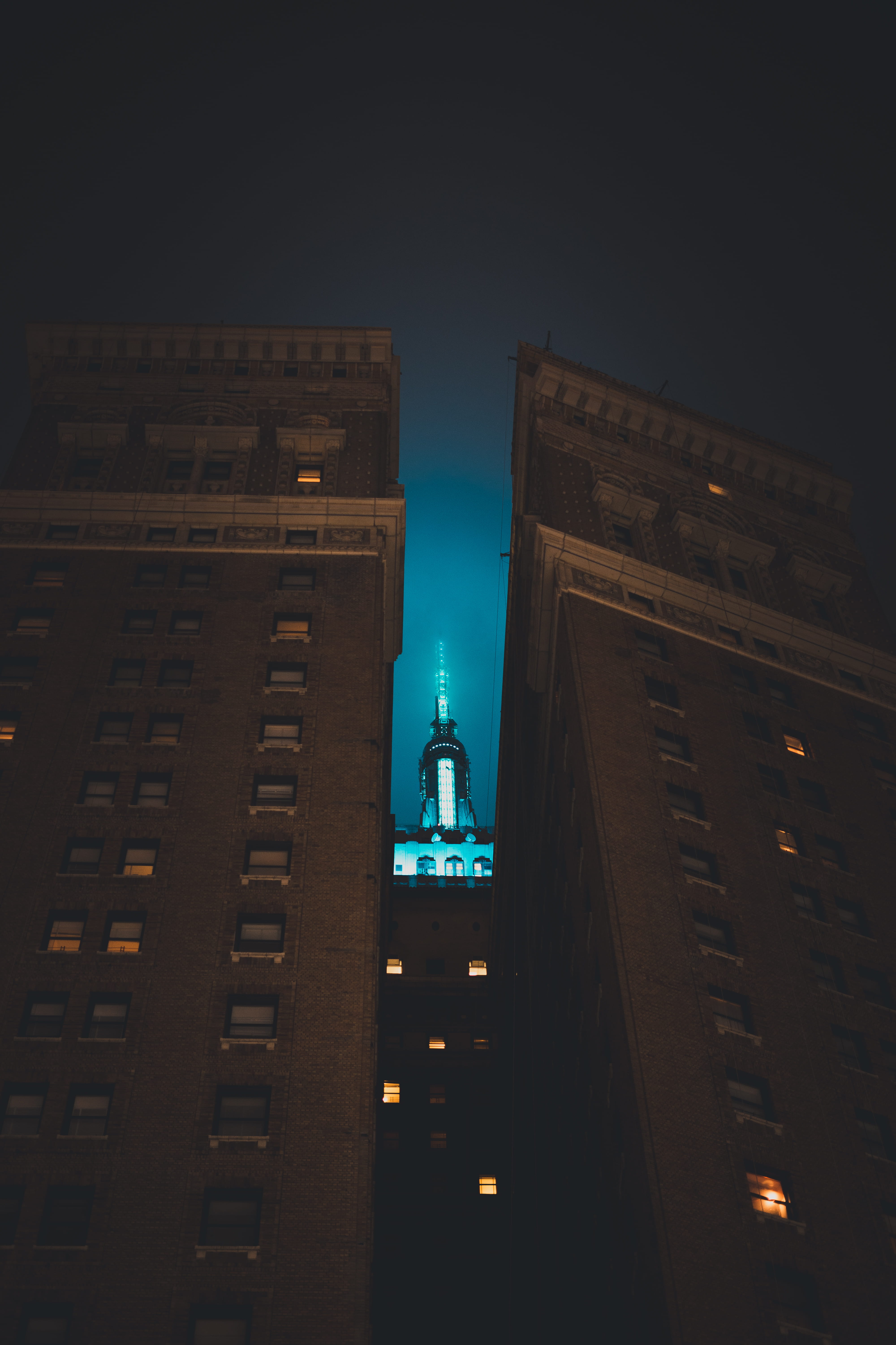 colors, steeple, buildings, low angle view, clouds, tall - high, night, metropolis, no people, 5K, architecture, clear sky, lighting equipment, empire state building, Phone HD Wallpaper