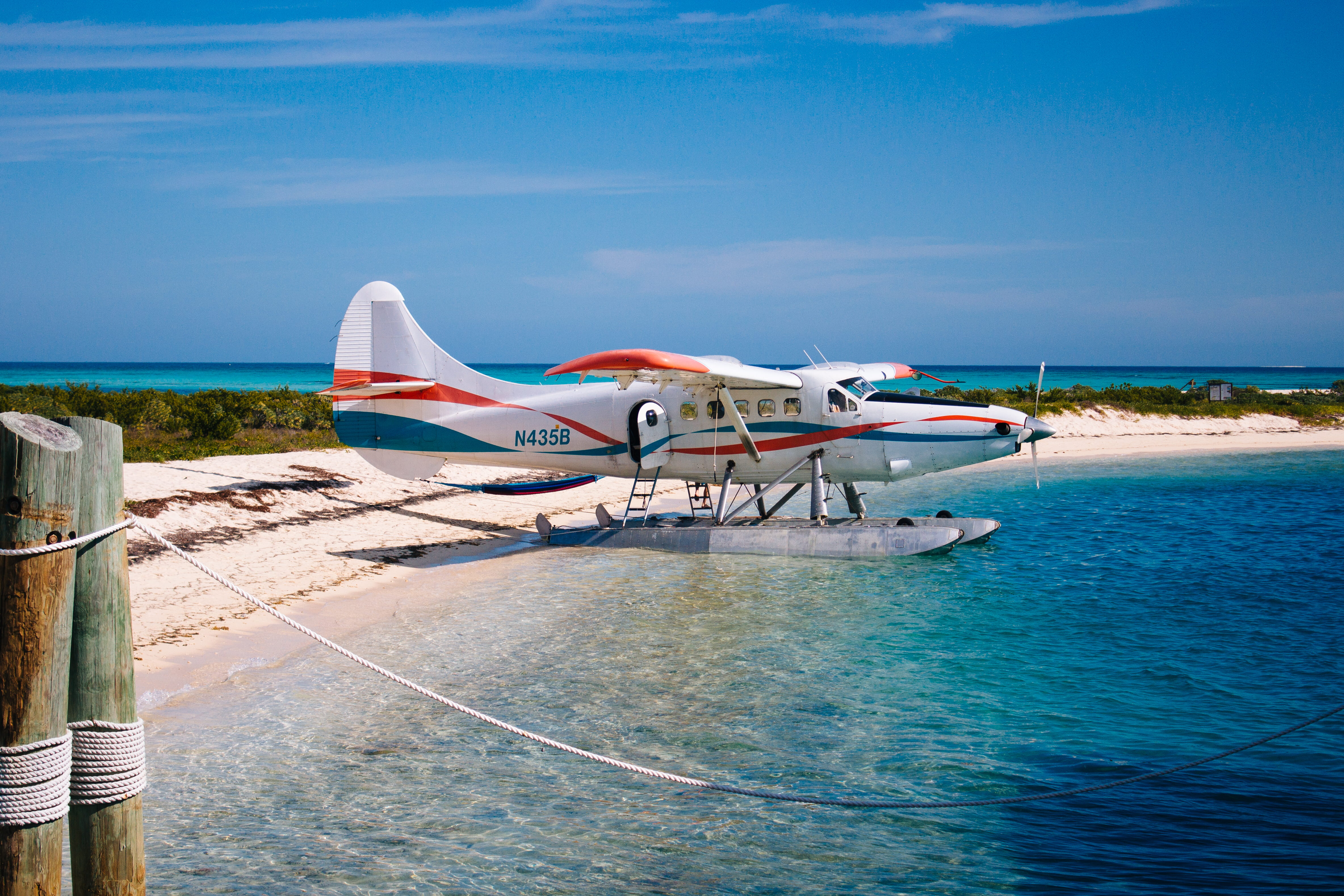 red, sky, travel, outdoors, airplane, sea, air vehicle, plane, mode of transportation, white, nature, land, 4K, blue, outrigger, shore, sunlight, beach, HD Wallpaper