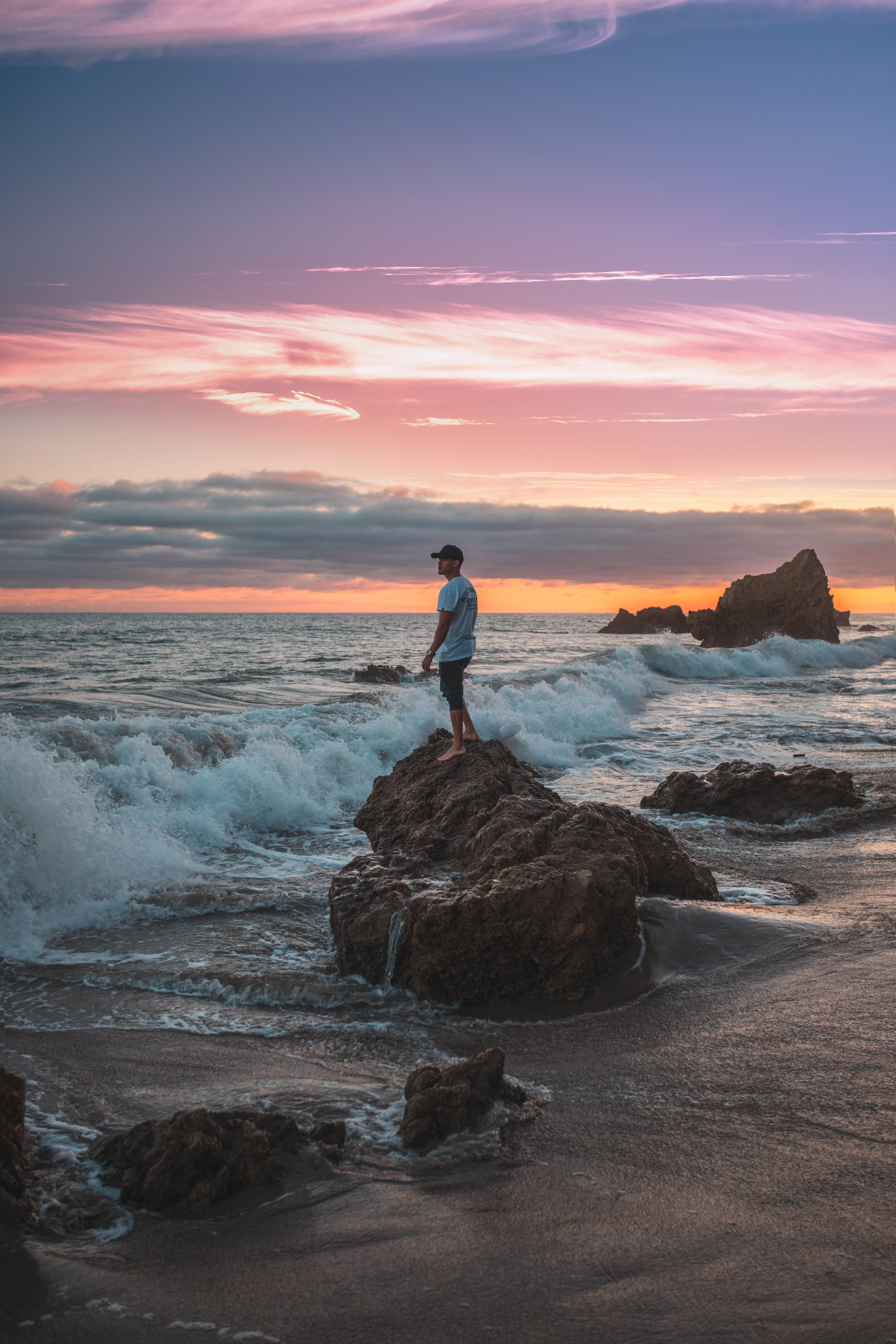waves, formation, daytime, real people, crashing wave, seashore, lifestyles, watching, cloud - sky, horizon, beach, man, rock, outdoors, coast, water, one person, Phone HD Wallpaper