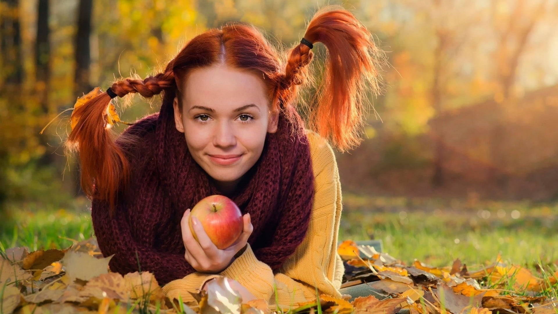 smiling, 1080P, nature, grass, fall, trees, model, women, long hair, scarf, women outdoors, apples, sweater, lying on front, looking at viewer, fruit, HD Wallpaper
