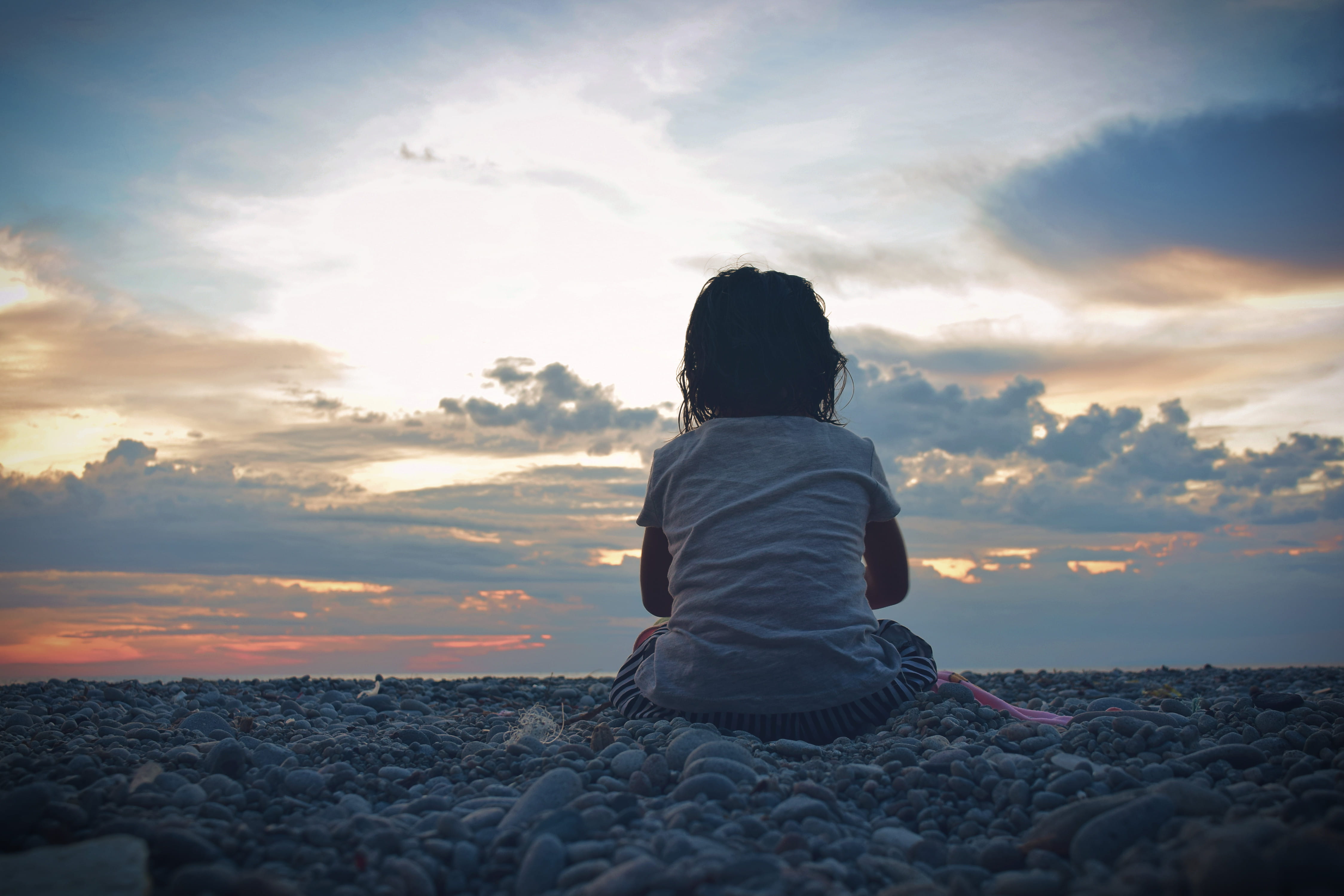 real people, beauty in nature, sunset, pebbles, rock, nature, land, cloud, one person, cloud - sky, sky, sitting, looc road, tranquility, 4K, leisure activity, HD Wallpaper