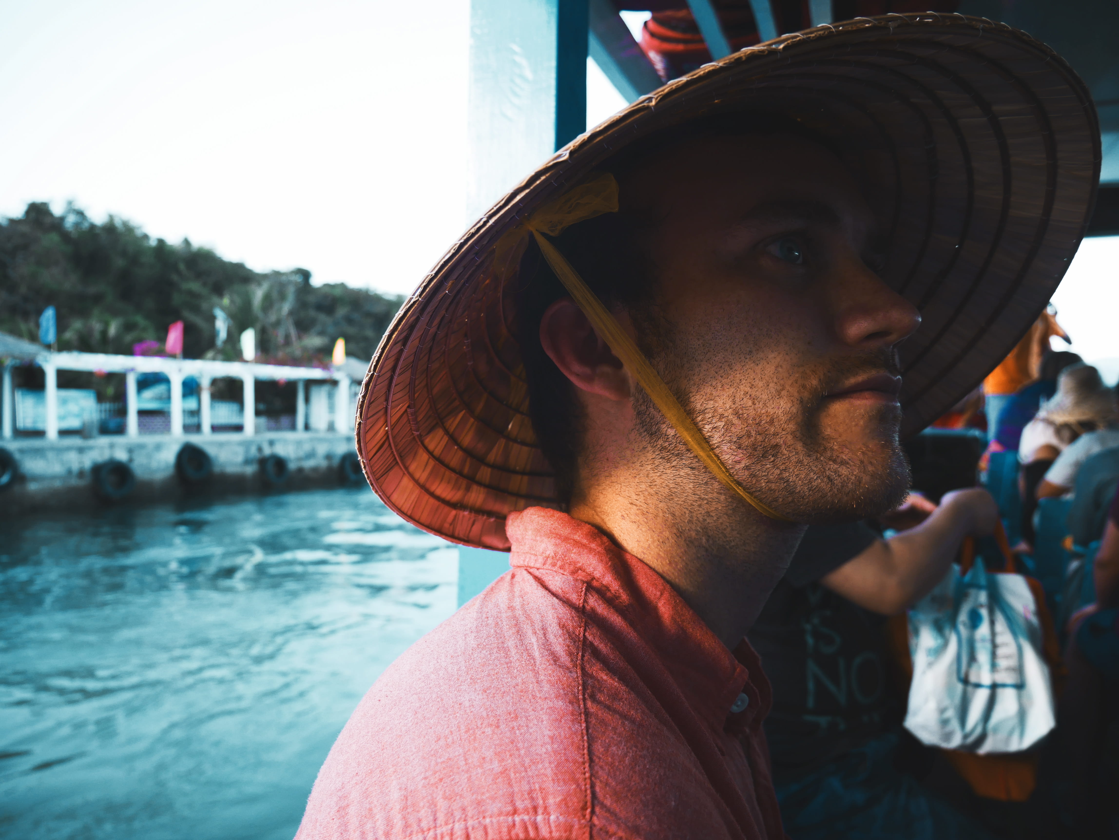 rice paddy hat, water, real people, travel, lifestyles, young traveler, portrait, boat, clothing, vietnamese hat, headshot, hat, contemplation, vietnam, HD Wallpaper