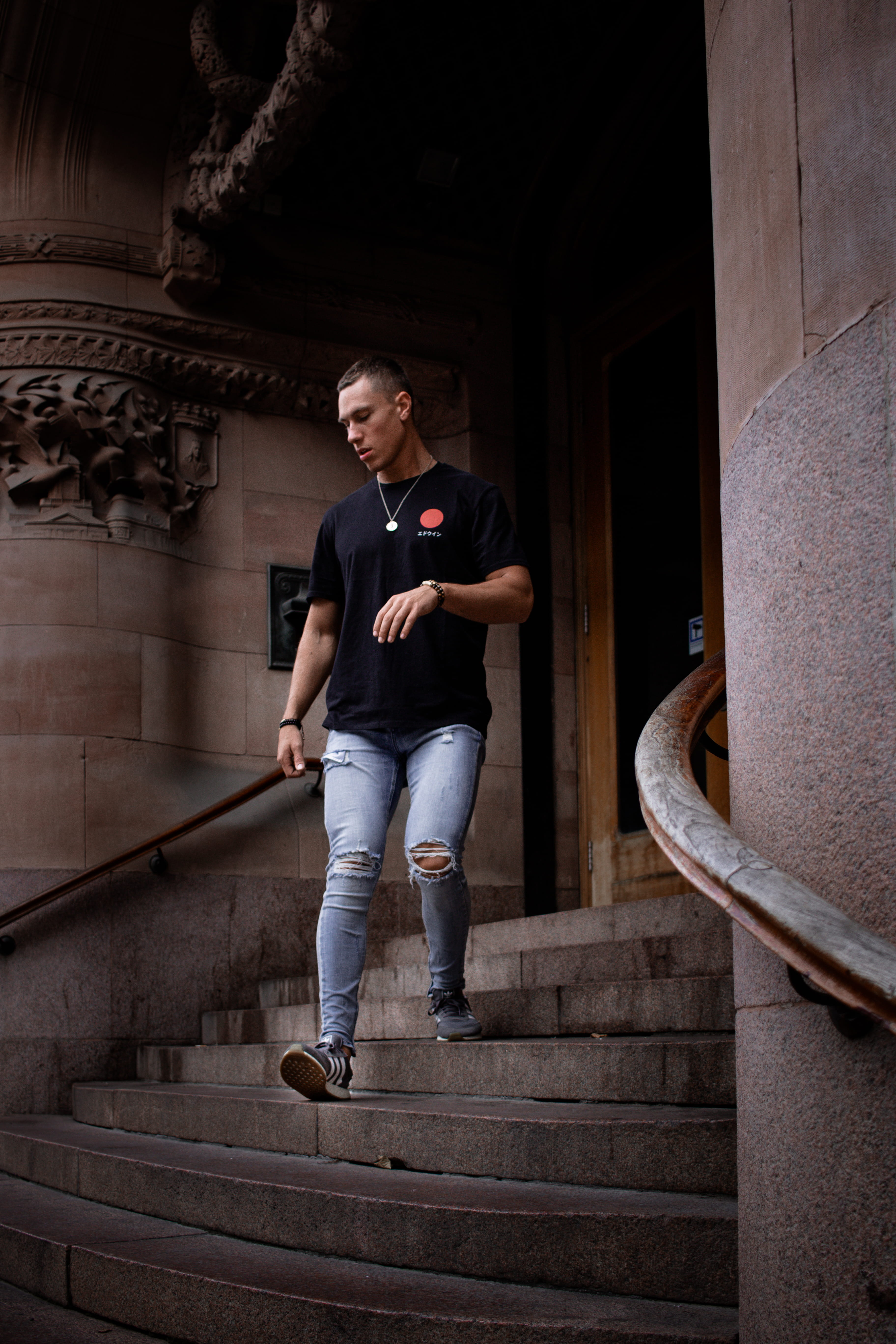 male, casual clothing, staircase, watch, real people, city, neckless, stairs, necklace, person, step, contemplation, japan, stair, standing, ripped jean, Phone HD Wallpaper