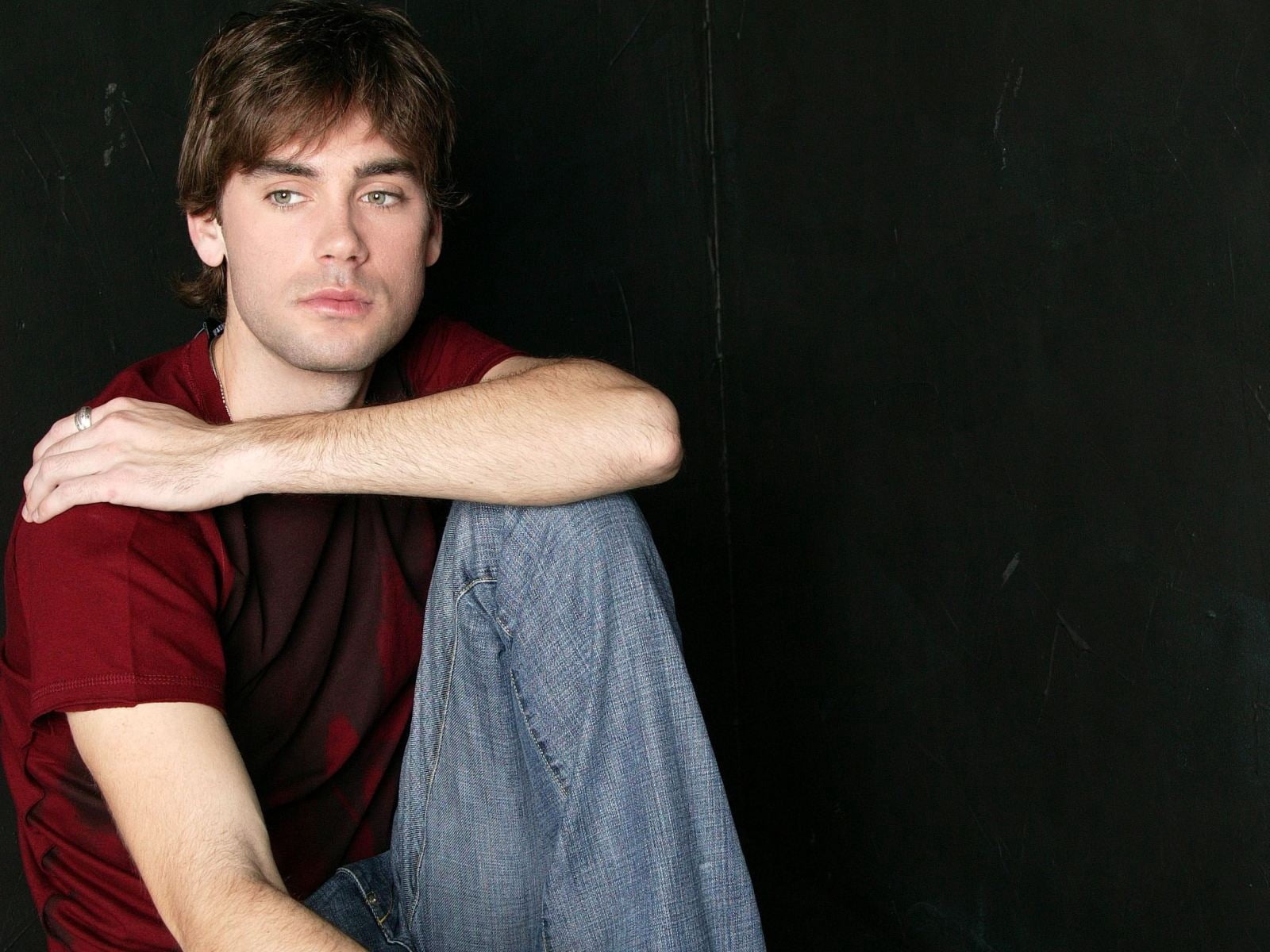 black background, one person, men, white, young adult, t-shirt, neck, drew fuller, studio shot, dark, copy space, s, looking at camera, t, maroon, portrait, HD Wallpaper