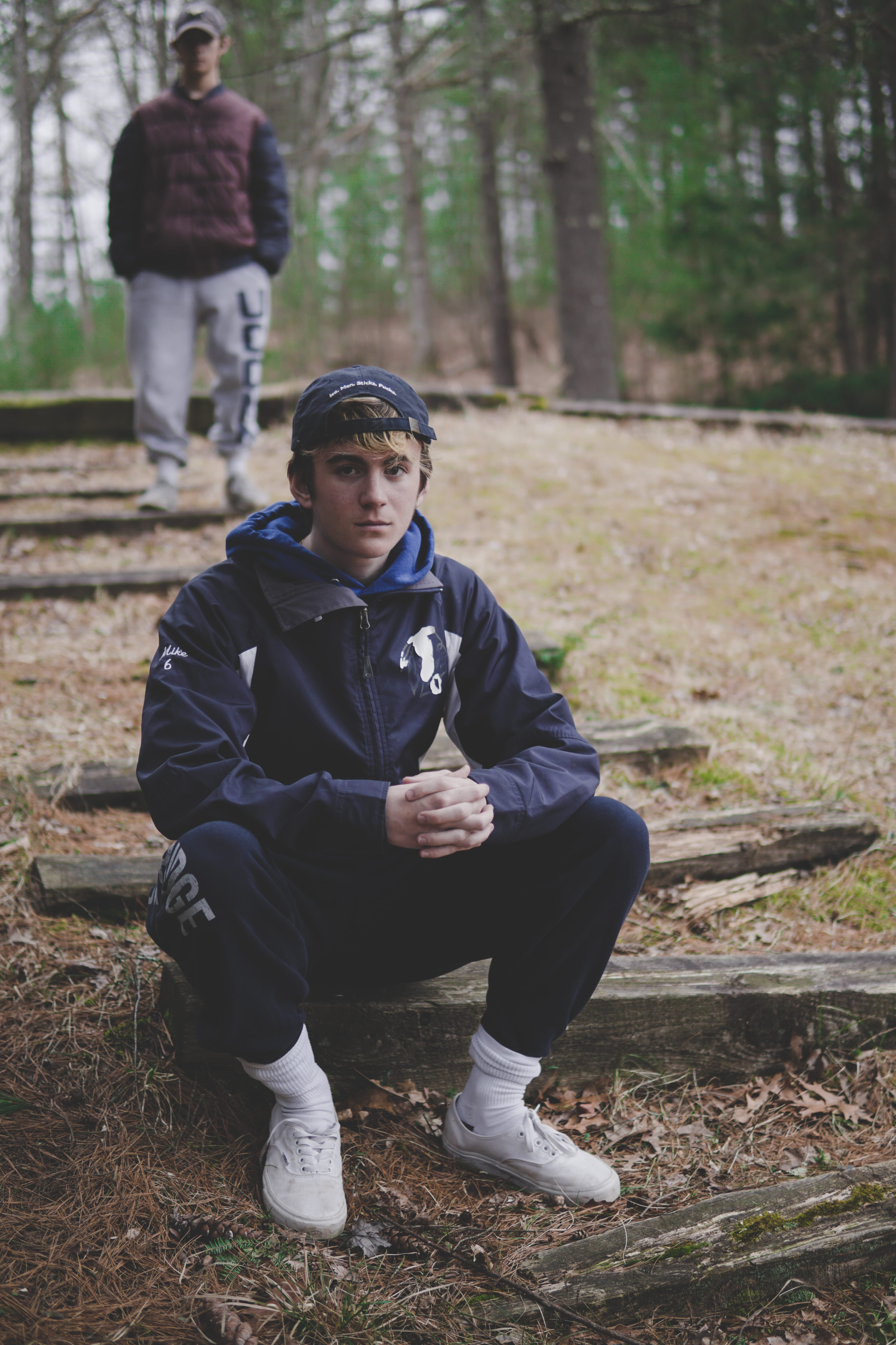 trees, 5K, green, child, sitting, childhood, field, mature men, tall, people, casual clothing, boys, plant, log, forest, gray, outdoors, real people, day, Phone HD Wallpaper