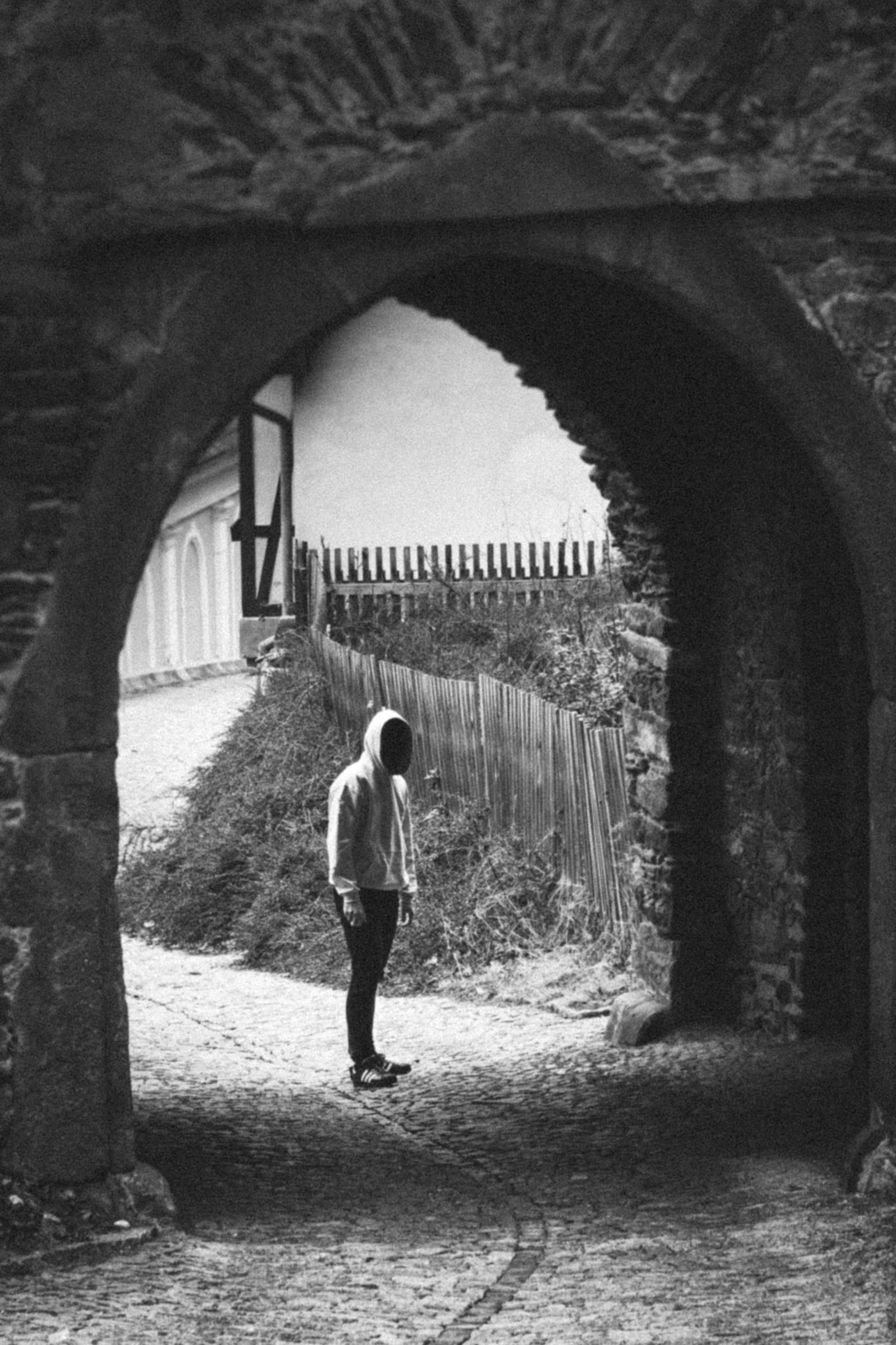 moody, one person, built structure, the way forward, day, men, black, 2K, mood, outdoors, guy, leisure activity, walking, building exterior, mysterious, Phone HD Wallpaper