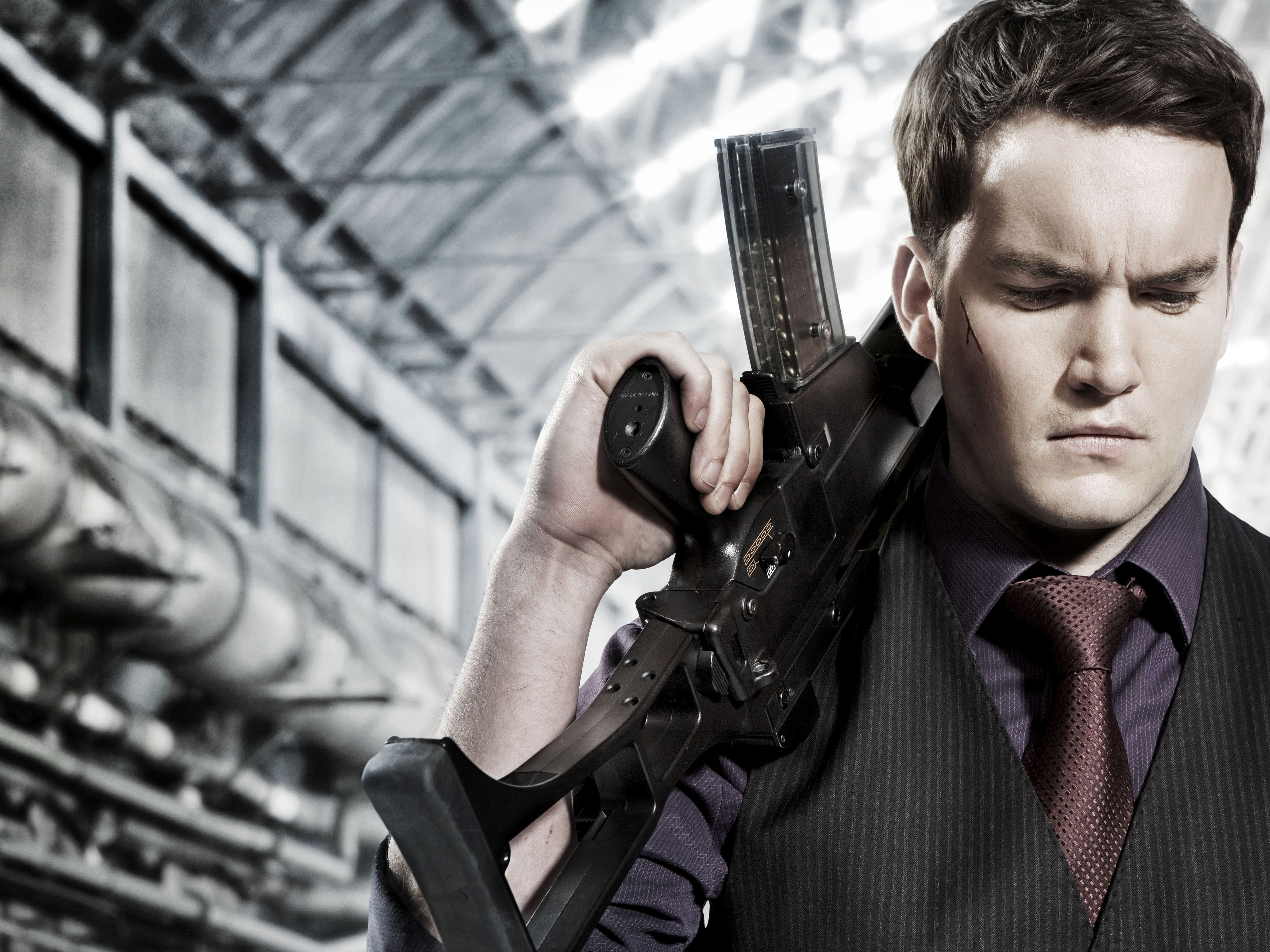 weapon, men, gun, holding, architecture, portrait, serious, front view, males, headshot, mid adult, 4K, rifle, technology, handgun, communication, adult, HD Wallpaper