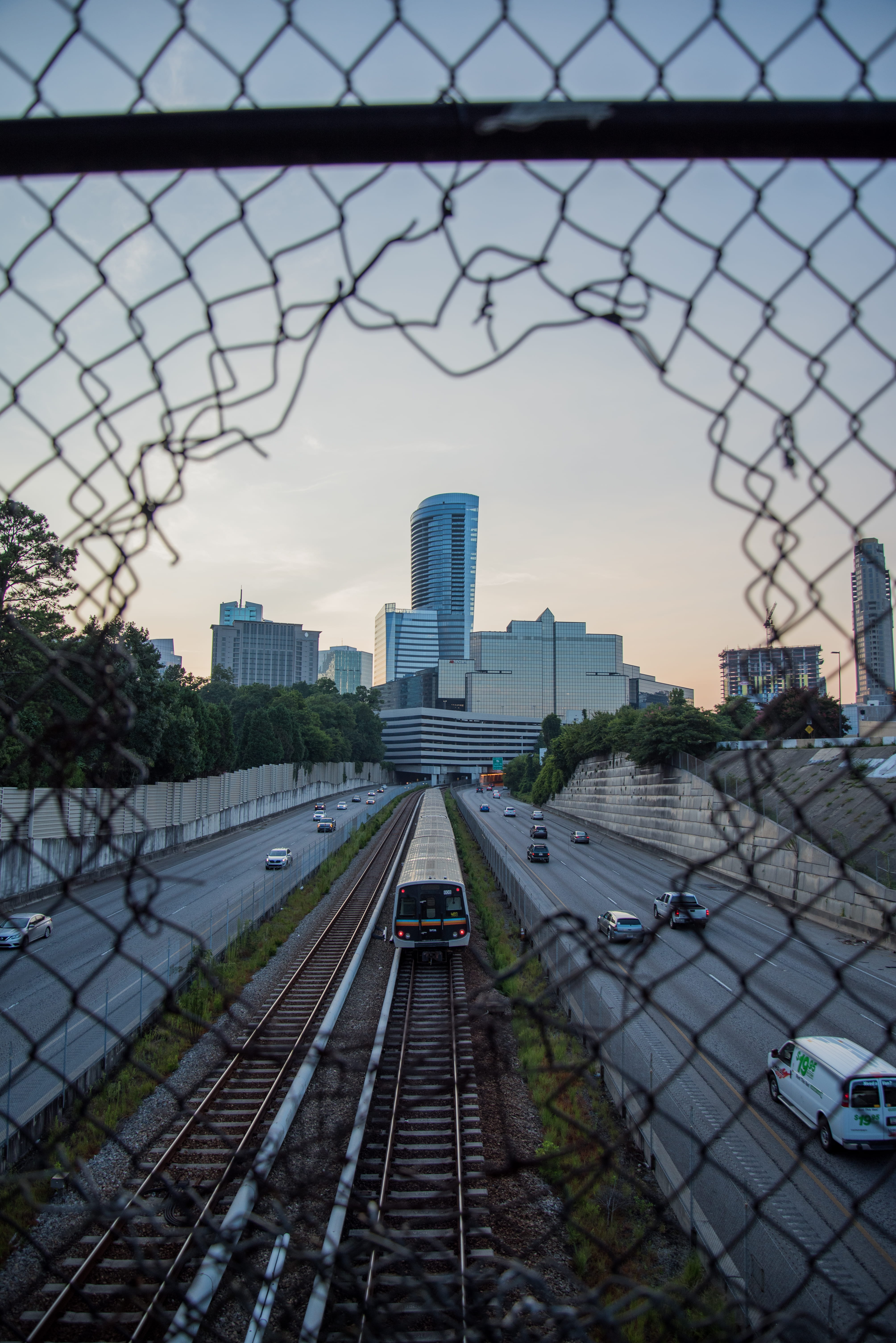 railroad track, outdoors, skyscapers, fence, mode of transportation, 5K, architecture, modern, tower, skyscraper, building, transportation, cityscape, Phone HD Wallpaper