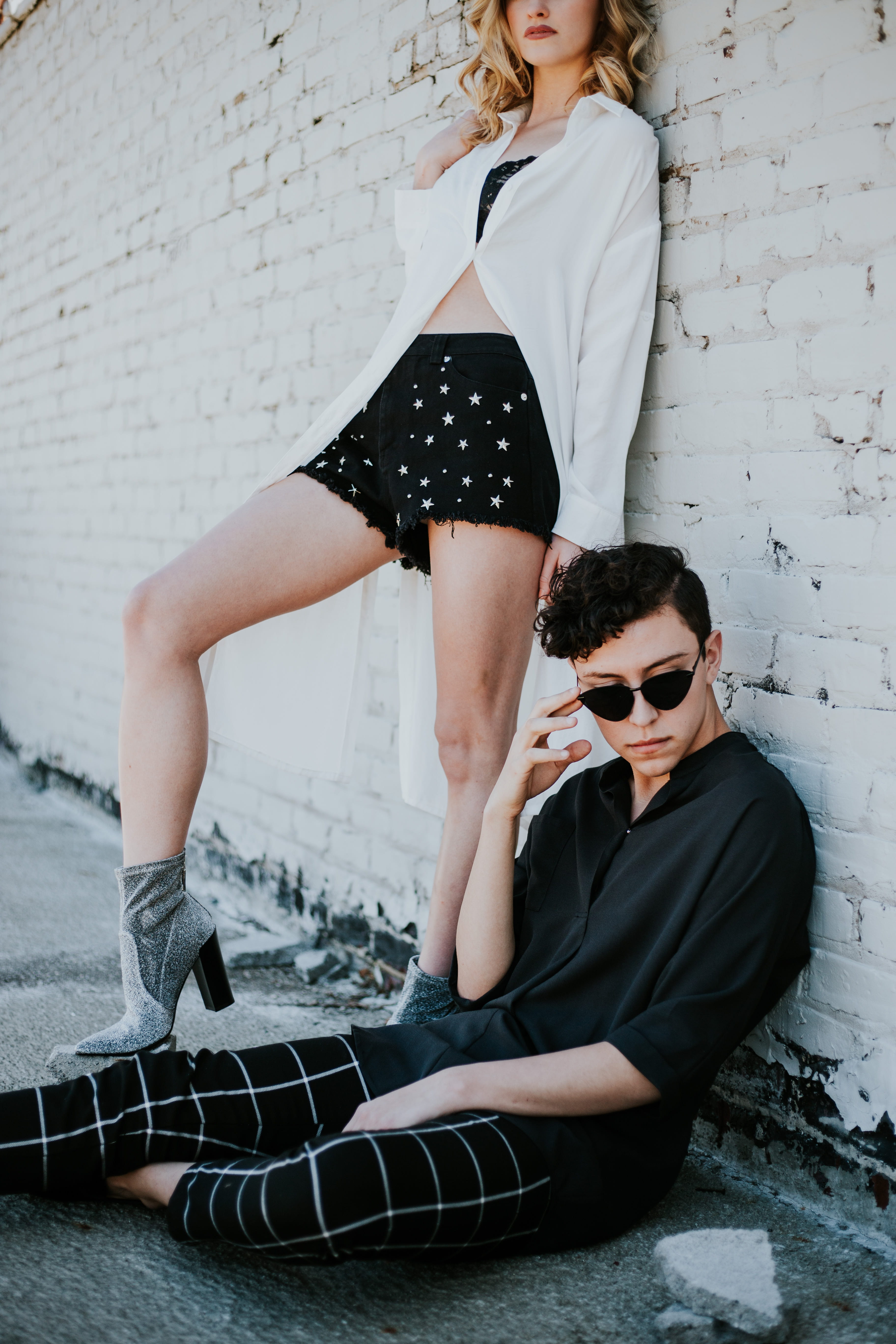 wall, women, fashion, photography, star, leisure activity, clothing, white, casual clothing, full length, caucasian, sitting, brick, city, woman, street, Phone HD Wallpaper