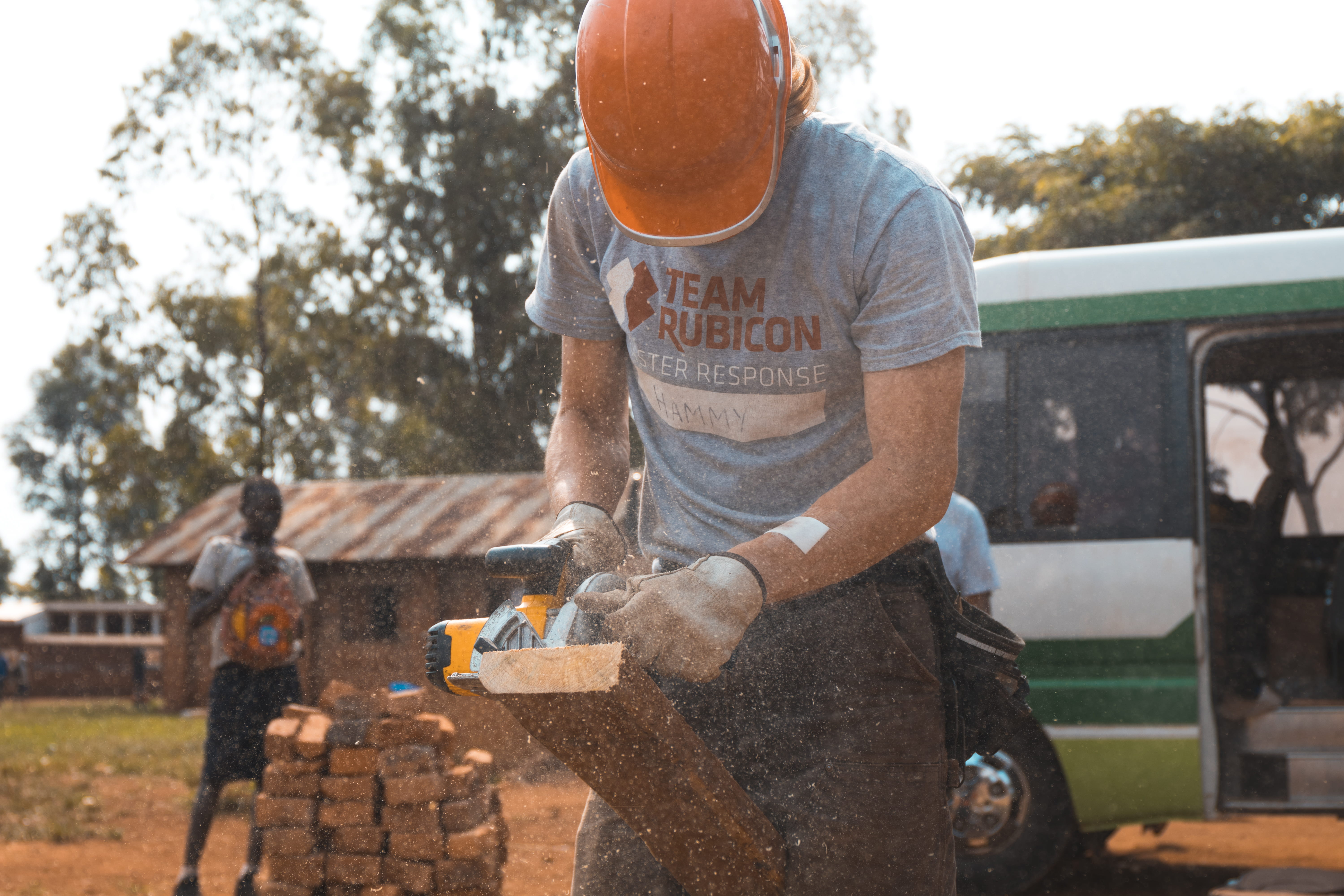uganda, man, outdoors, caucasian, power saw, cut, three quarter length, relief, lifestyles, leisure activity, tool, equipment, focus on foreground, one person, HD Wallpaper