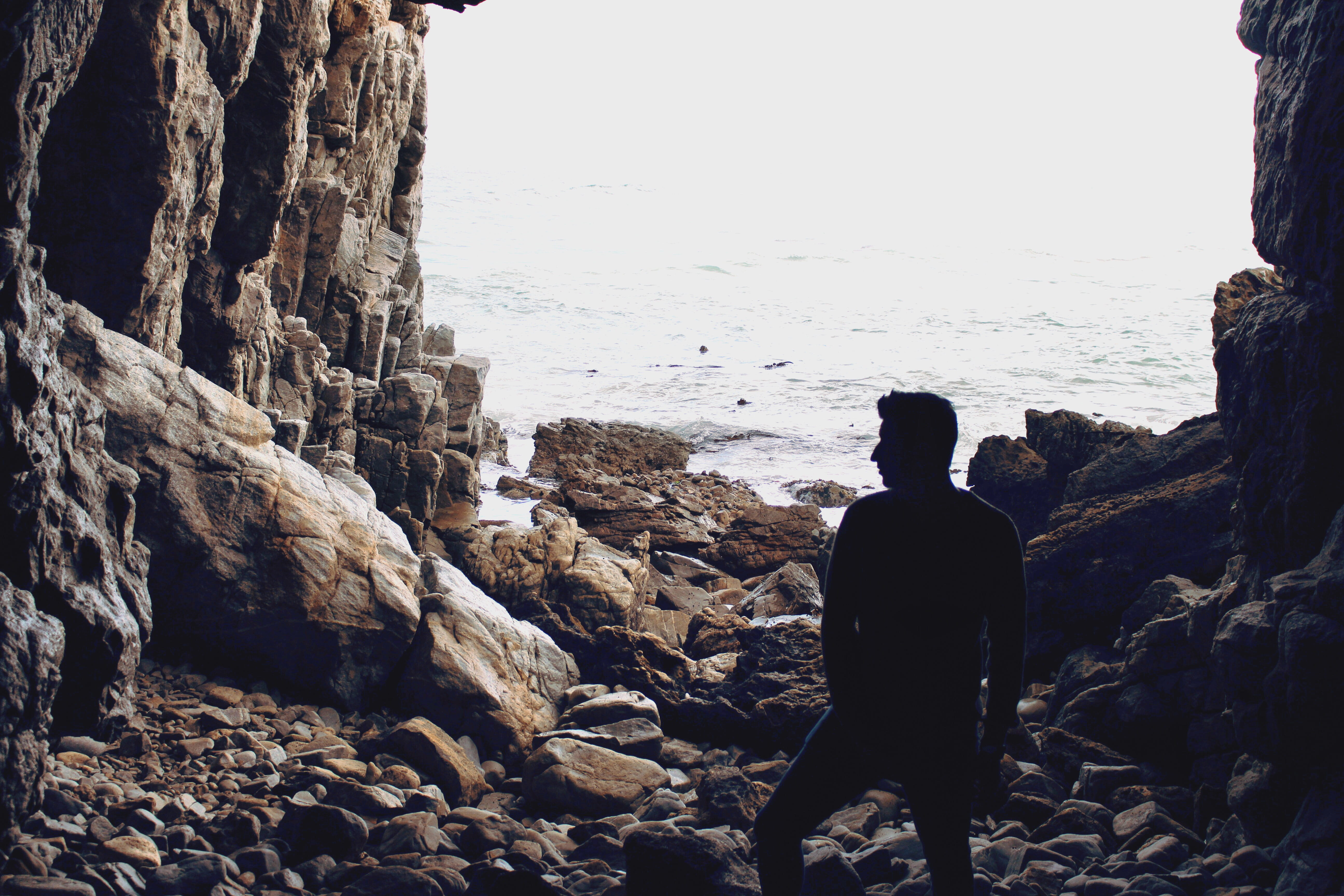 rock, beach, solid, rocks, south africa, land, one person, day, nature, water, rear view, me, lifestyles, sky, explore, cave, pose, 5K, lost, lostboys, HD Wallpaper