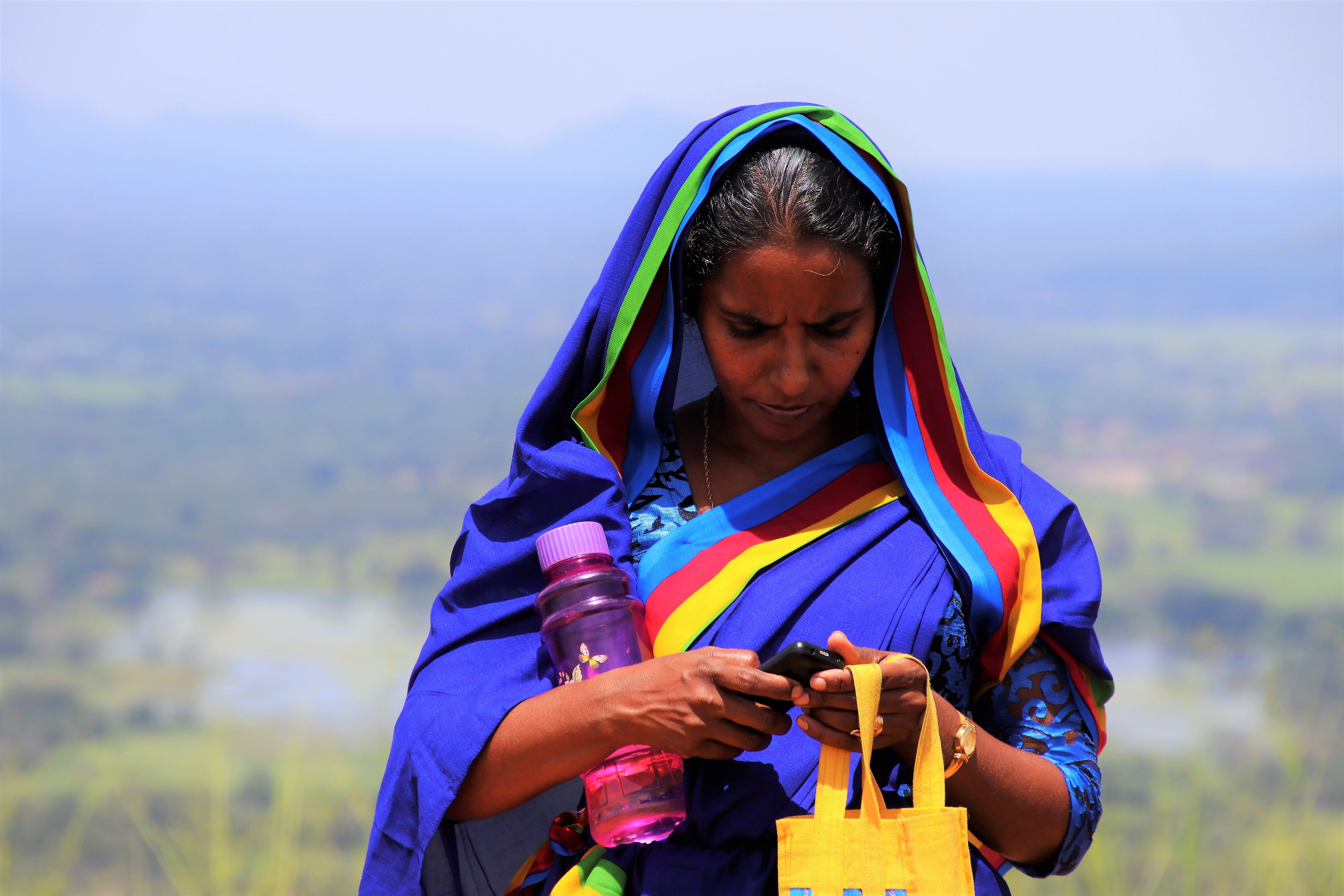 wireless technology, holiday, hood - clothing, girl, spirituality, sit, face, young adult, sari, mobile phone, youth, one person, phone, portrait of a woman, HD Wallpaper