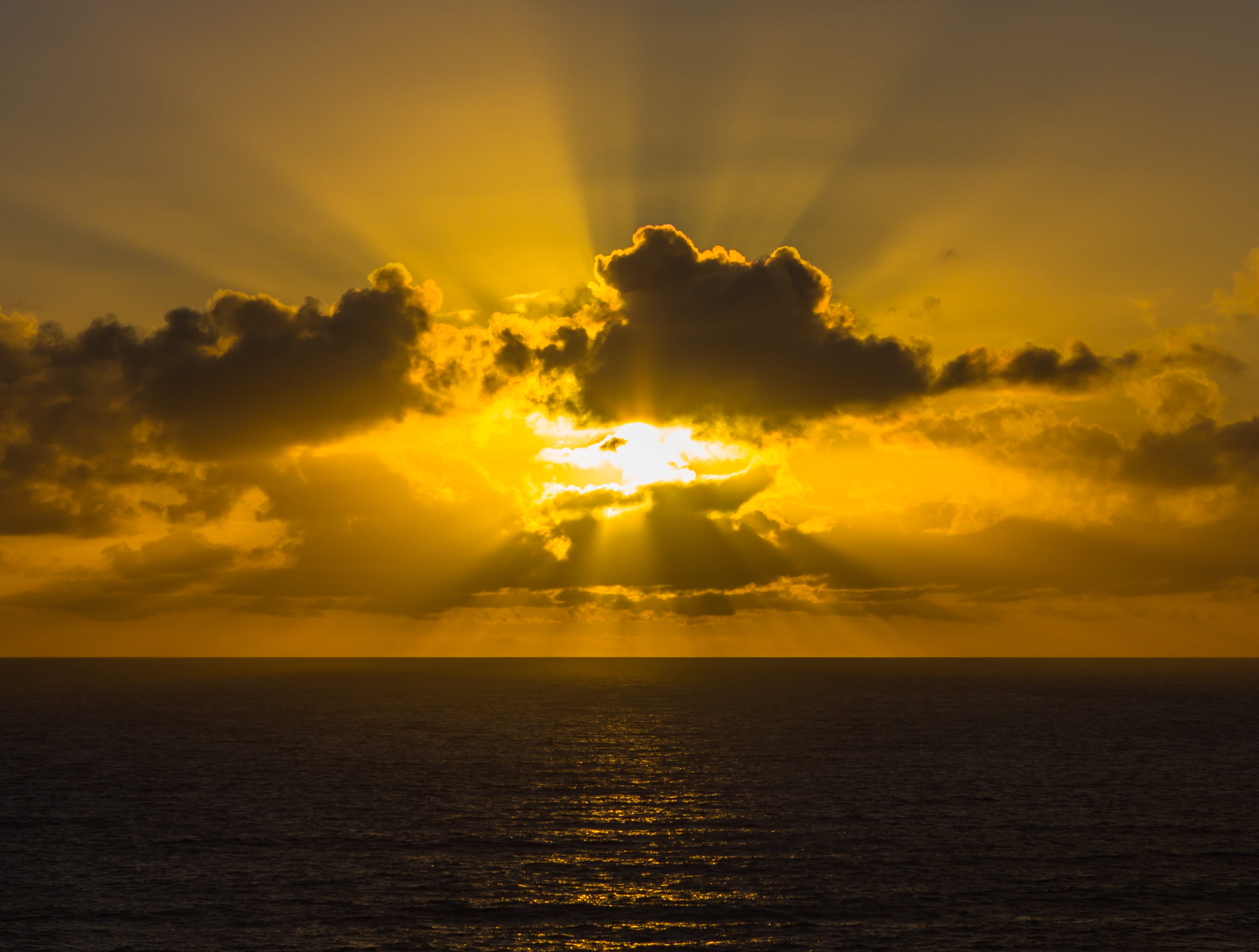 cloud - sky, tranquility, ocean, sky, rays, no people, 2K, golden, nature, clouds, sun, horizon, idyllic, yellow, waterfront, cloudscape, beam, HD Wallpaper