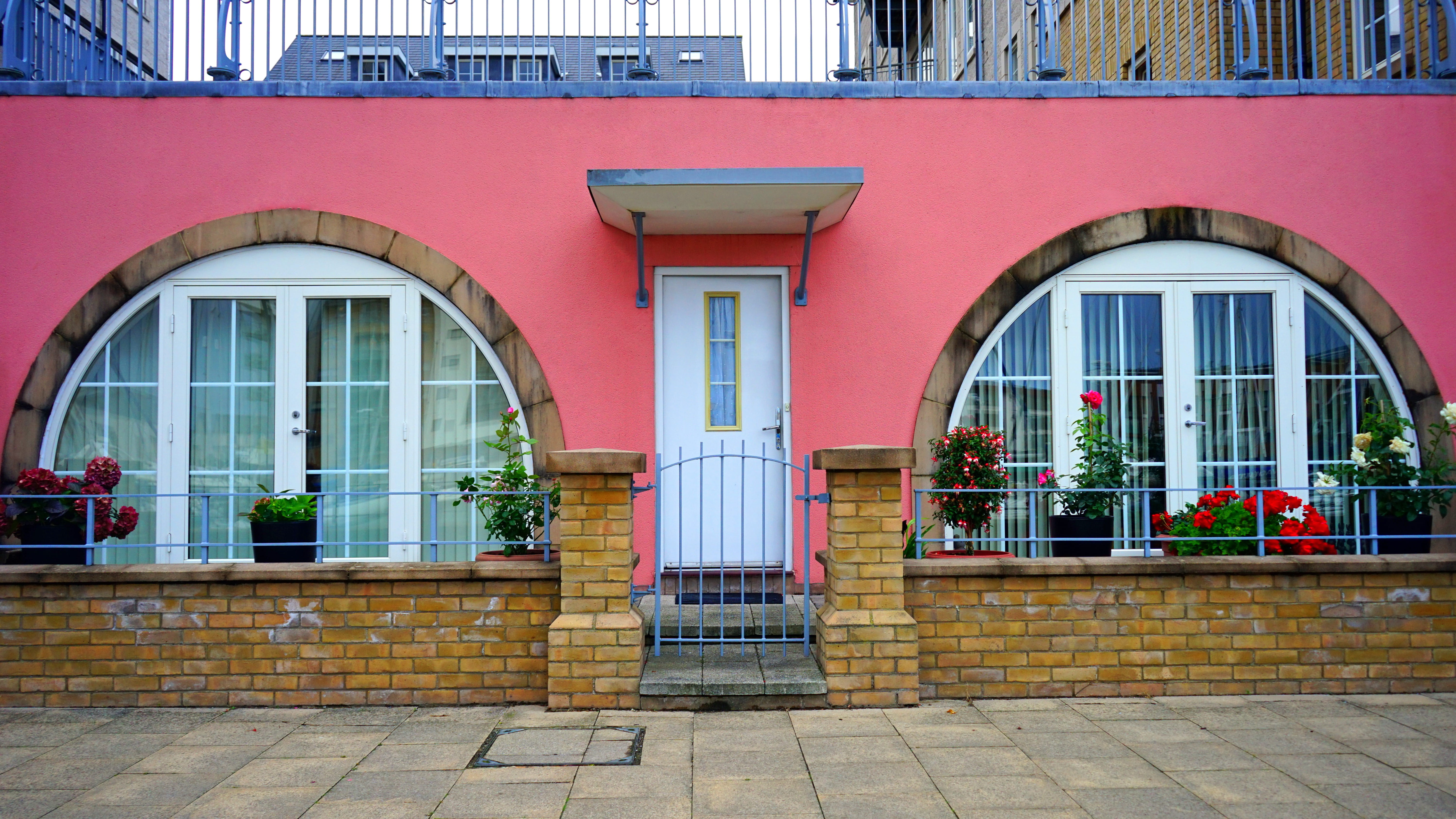 pavement, street, pink, row house, city, arch, brick, entrance, building exterior, classic, windows, no people, building, exterior, luxury, architecture, HD Wallpaper