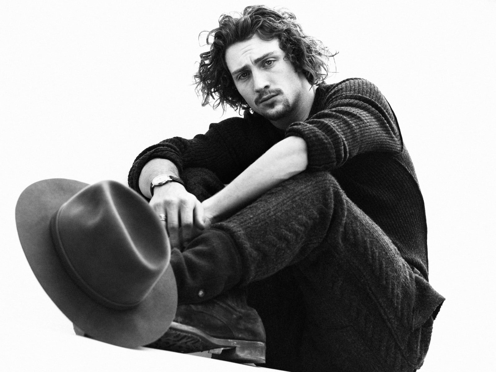 looking at camera, one person, men, indoors, sweatshirt, 720P, young men, aggression, sitting, aaron taylor-johnson, hat, photoshoot, young women, teenager, HD Wallpaper