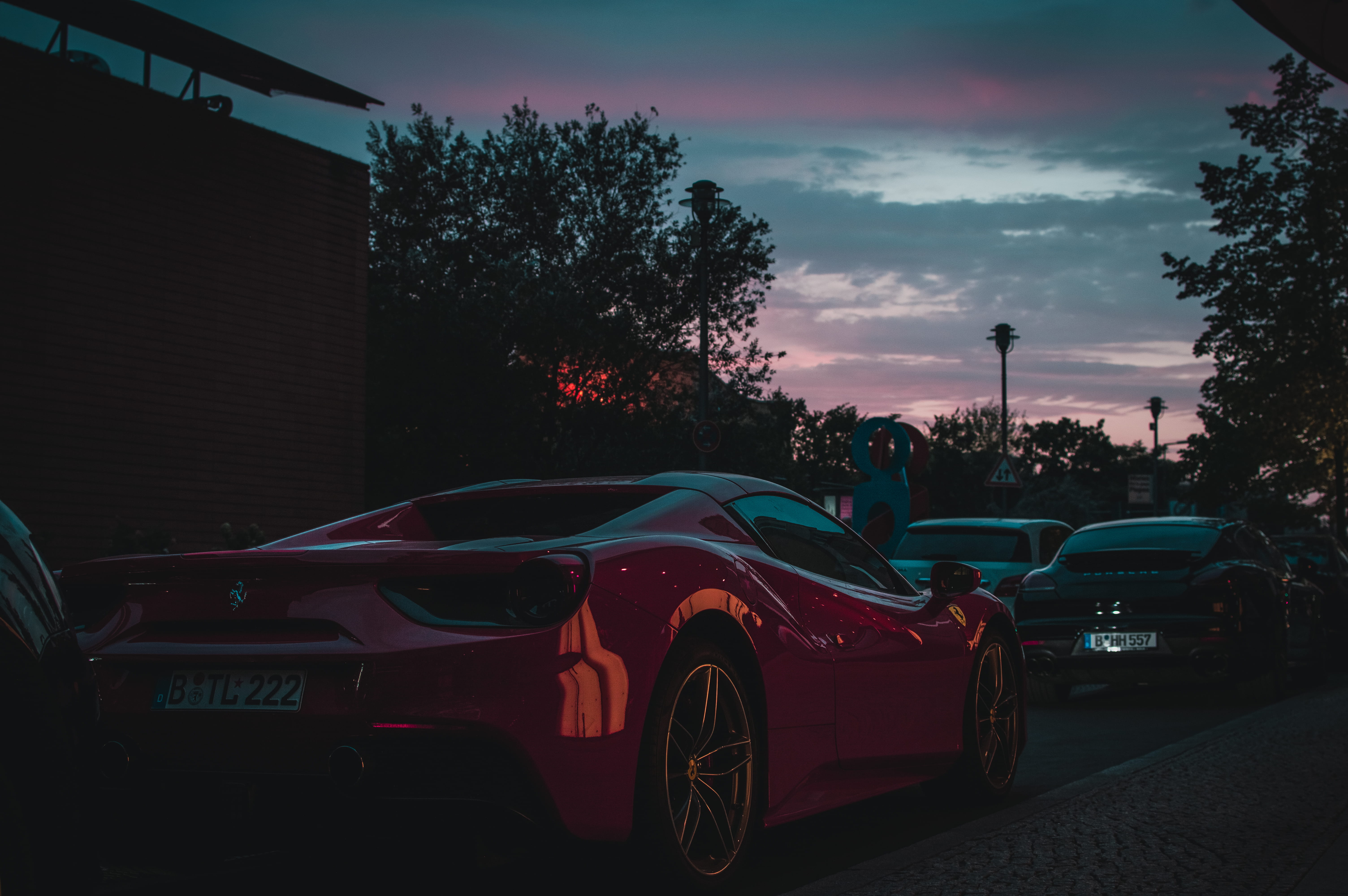 motor vehicle, tree, red car, vehicle, building exterior, close, dusk, spoke, berlin, coupe, cloud - sky, sports, outdoors, car wheel, night time, ferrari, HD Wallpaper