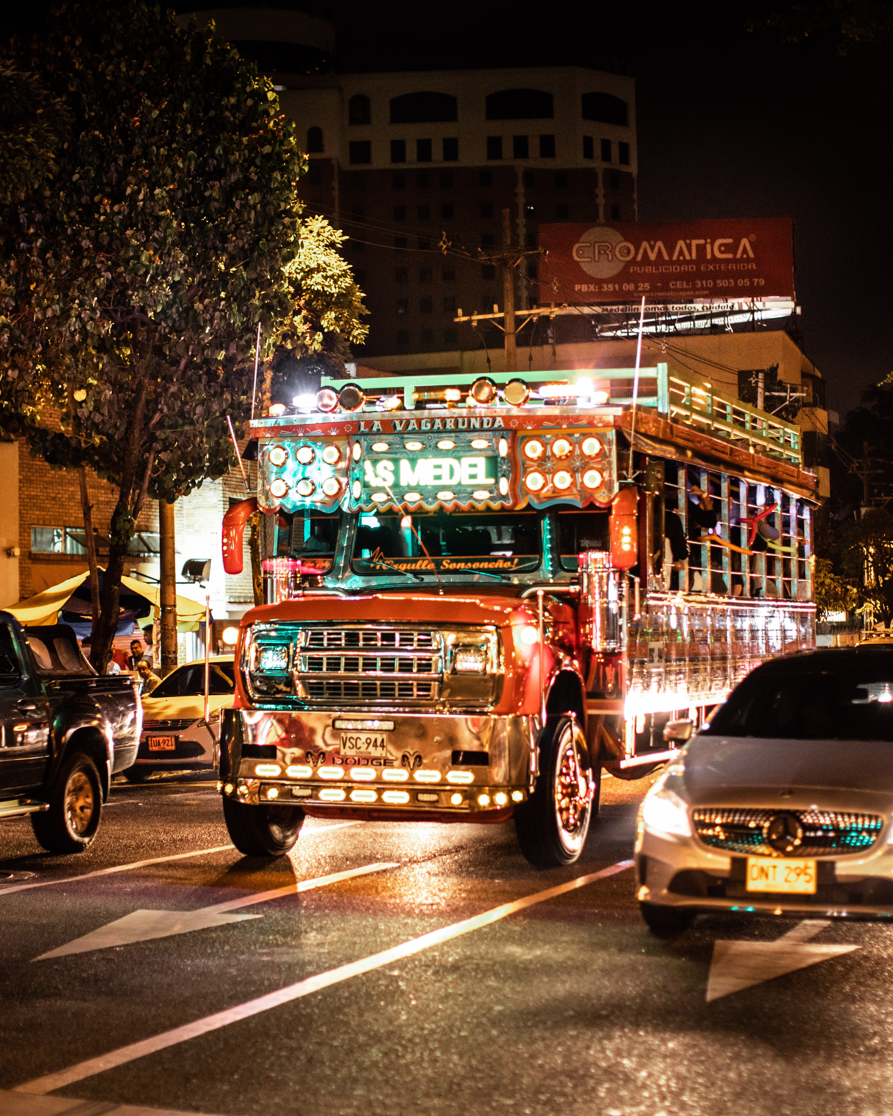 city street, incidental people, street, transportation, building exterior, 4K, outdoors, city, mode of transportation, tree, jeepney, red, nightlife, road, Phone HD Wallpaper