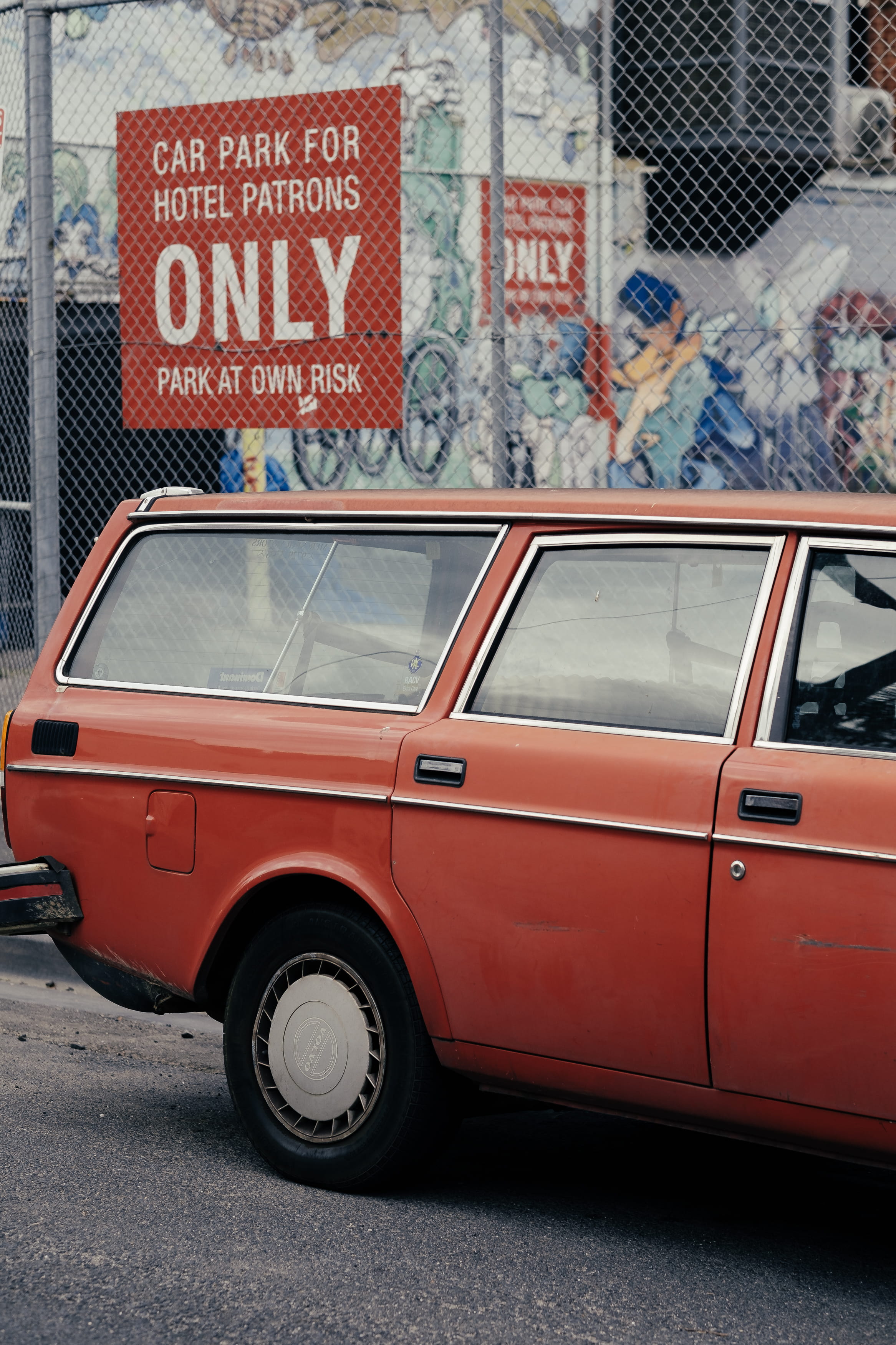 sedan, wheel, tire, mode of transportation, motor vehicle, graffiti, communication, automobile, outdoors, wagon, retro, street, human, wall, western script, Phone HD Wallpaper