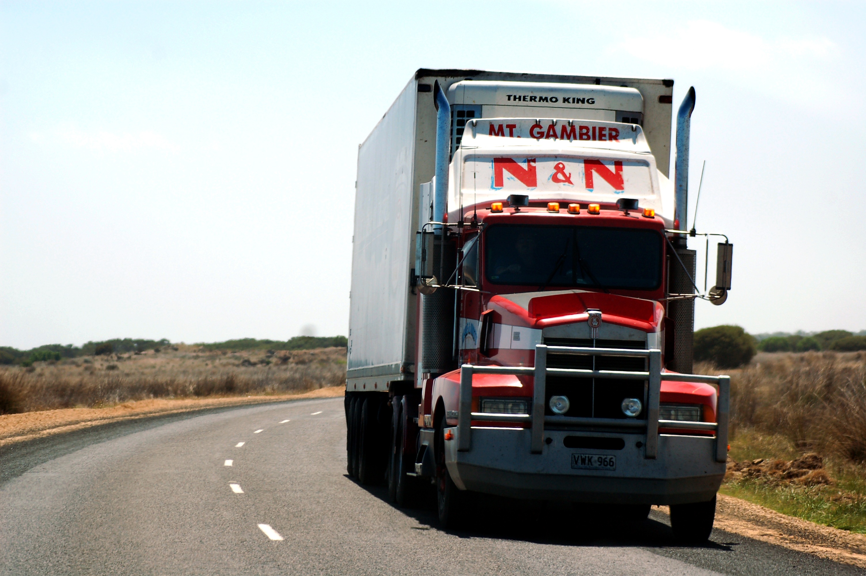 no people, sky, outdoors, motion, land, highway, landscape, text, white, truck, transport, land vehicle, red, freight, direction, semi-truck, gray, carriage of goods, HD Wallpaper